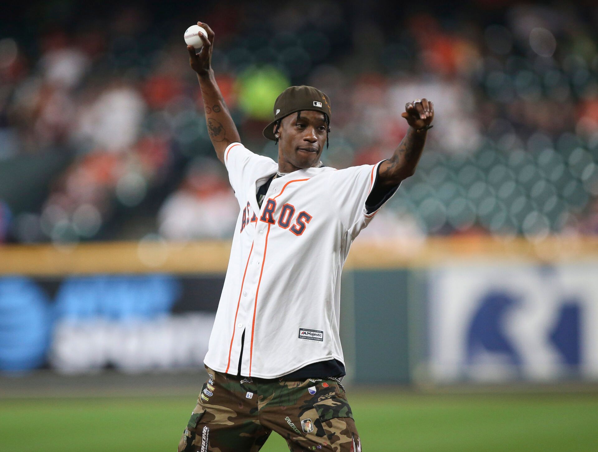 Recording artist Travis Scott throws out a ceremonial first pitch before a game between the Houston Astros and the Oakland Athletics at Minute Maid Park.