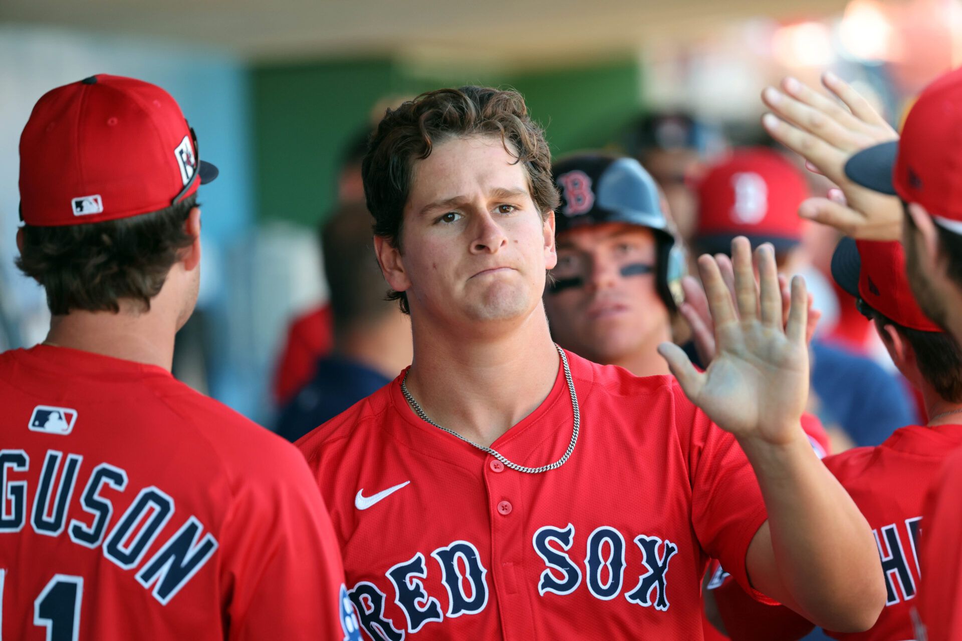Boston Red Sox outfielder Roman Anthony (48) is congratulated after he scored a run against the Philadelphia Phillies  during the third inning  at BayCare Ballpark.