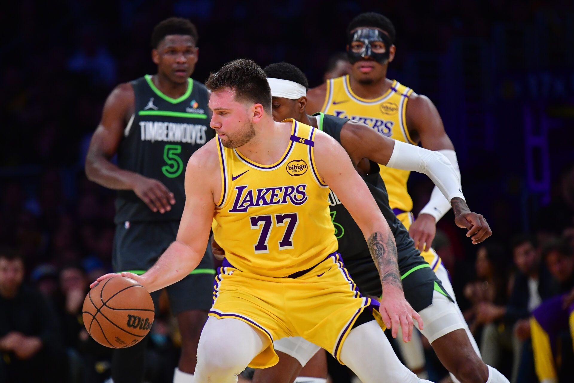 Los Angeles Lakers guard Luka Doncic (77) controls the ball against the Minnesota Timberwolves during the second half in game five of first round for the 2025 NBA Playoffs at Crypto.com Arena.