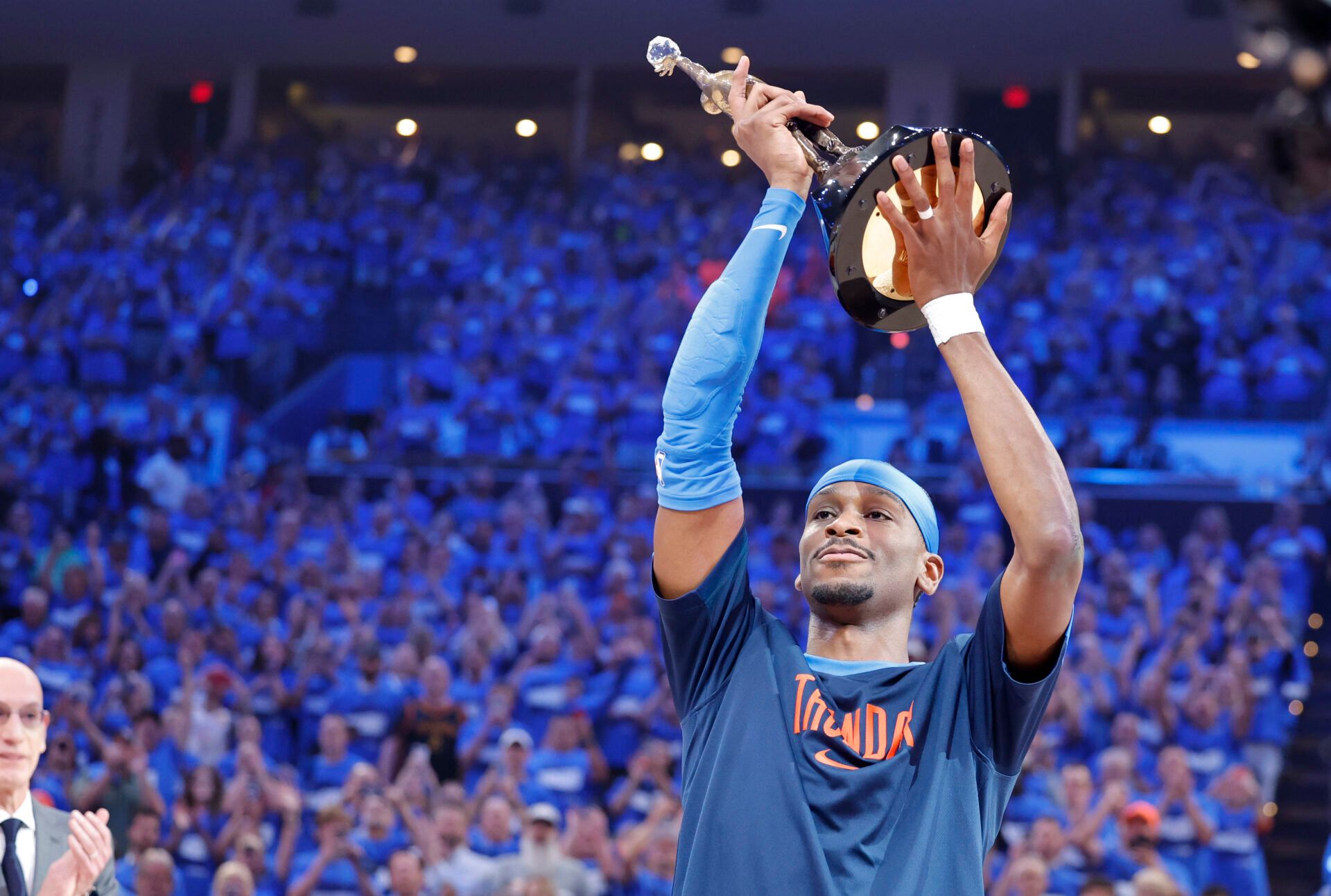NBA commissioner is Adam Silver presents Oklahoma City Thunder guard Shai Gilgeous-Alexander (2) with the Michael Jordan Trophy for winning the most valuable player award for the 2024-25 season before game two of the western conference finals for the 2025 NBA Playoffs at Paycom Center.