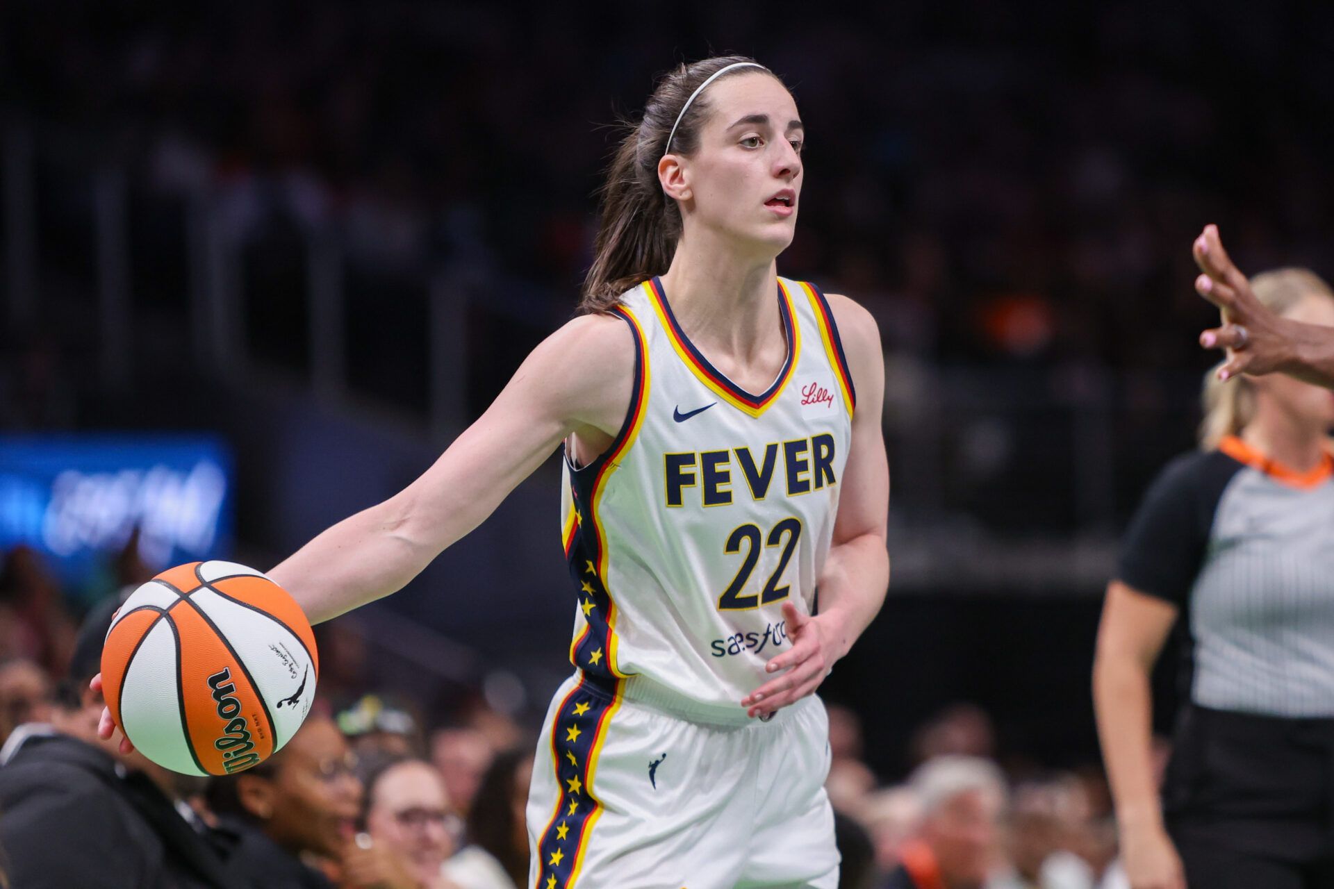 Indiana Fever guard Caitlin Clark (22) passes the ball against the Atlanta Dream in the third quarter at State Farm Arena.