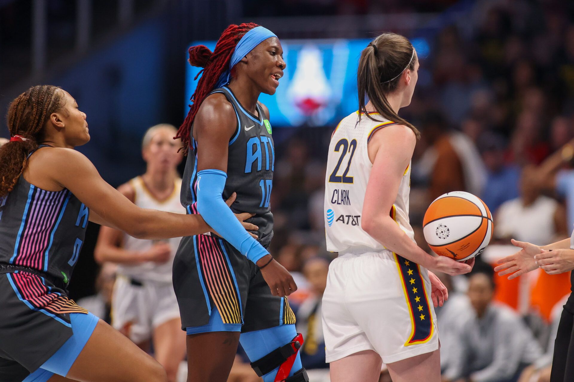 Atlanta Dream guard Rhyne Howard (10) gets in the face of Indiana Fever guard Caitlin Clark (22) in the first half at State Farm Arena.