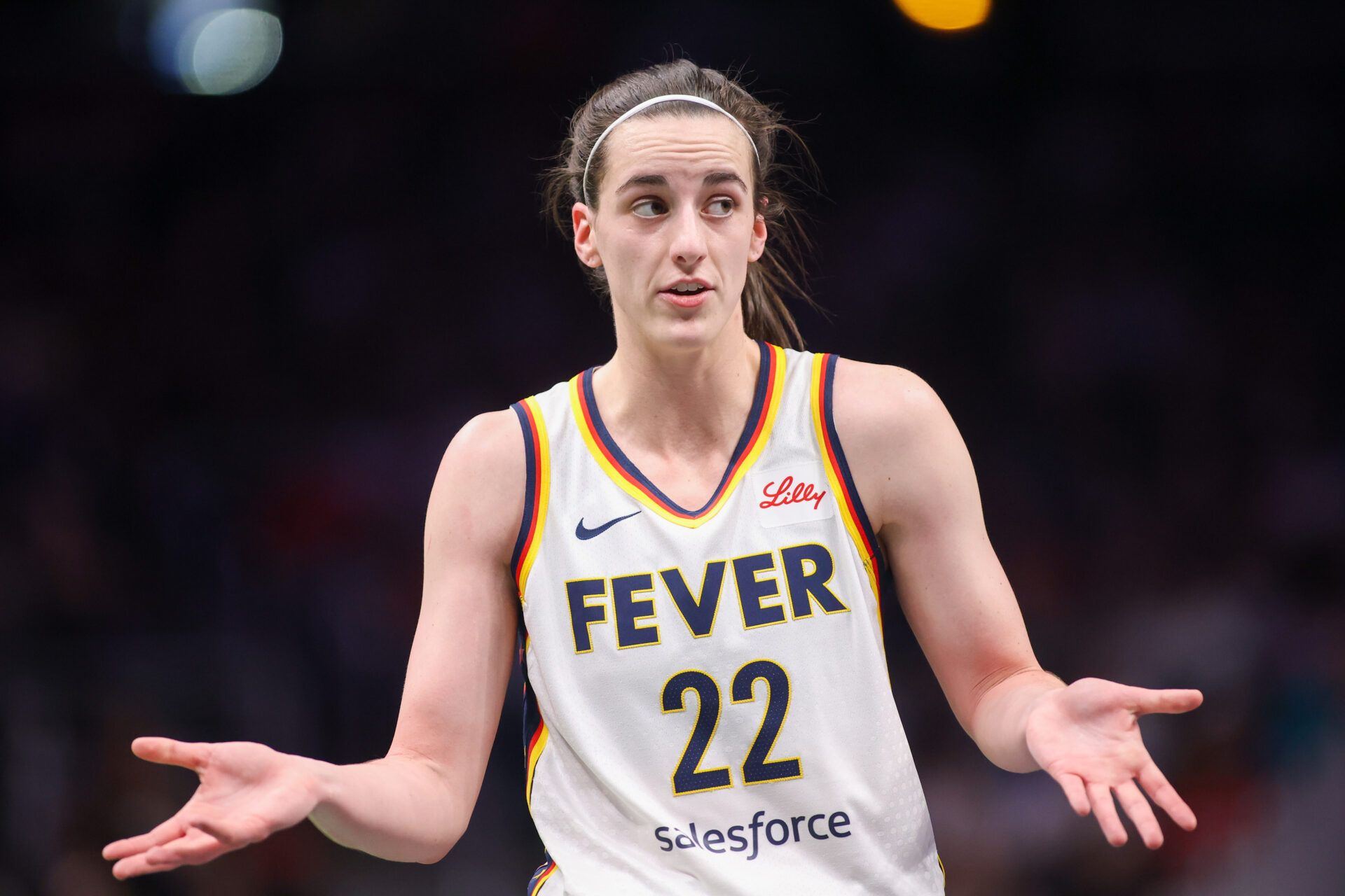 Indiana Fever guard Caitlin Clark (22) talks to a referee against the Atlanta Dream in the first half at State Farm Arena.