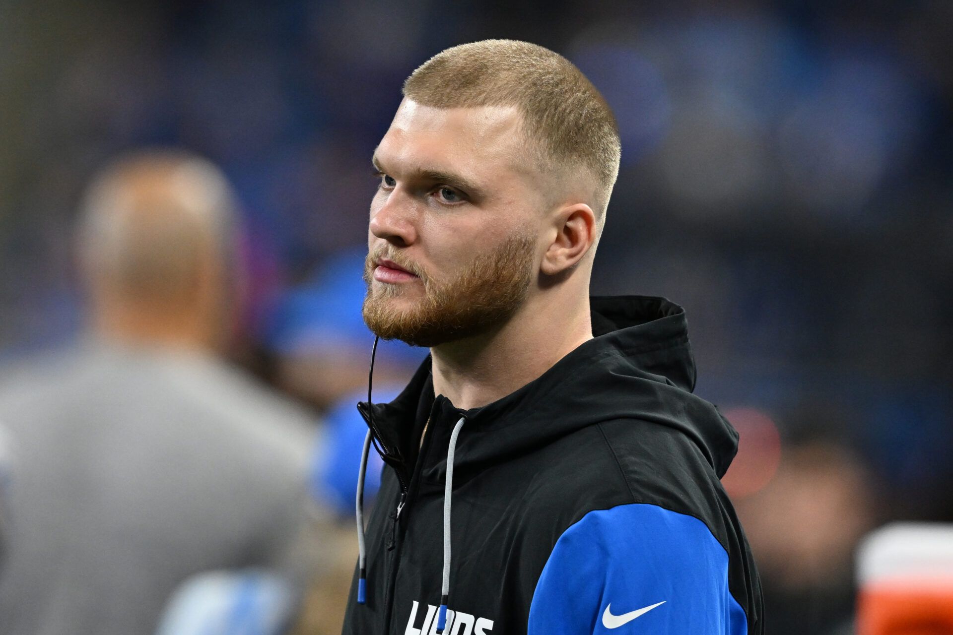 Detroit Lions defensive lineman Aidan Hutchinson (97) looks on from the bench during the fourth quarter against the Washington Commanders in a 2025 NFC divisional round game at Ford Field.