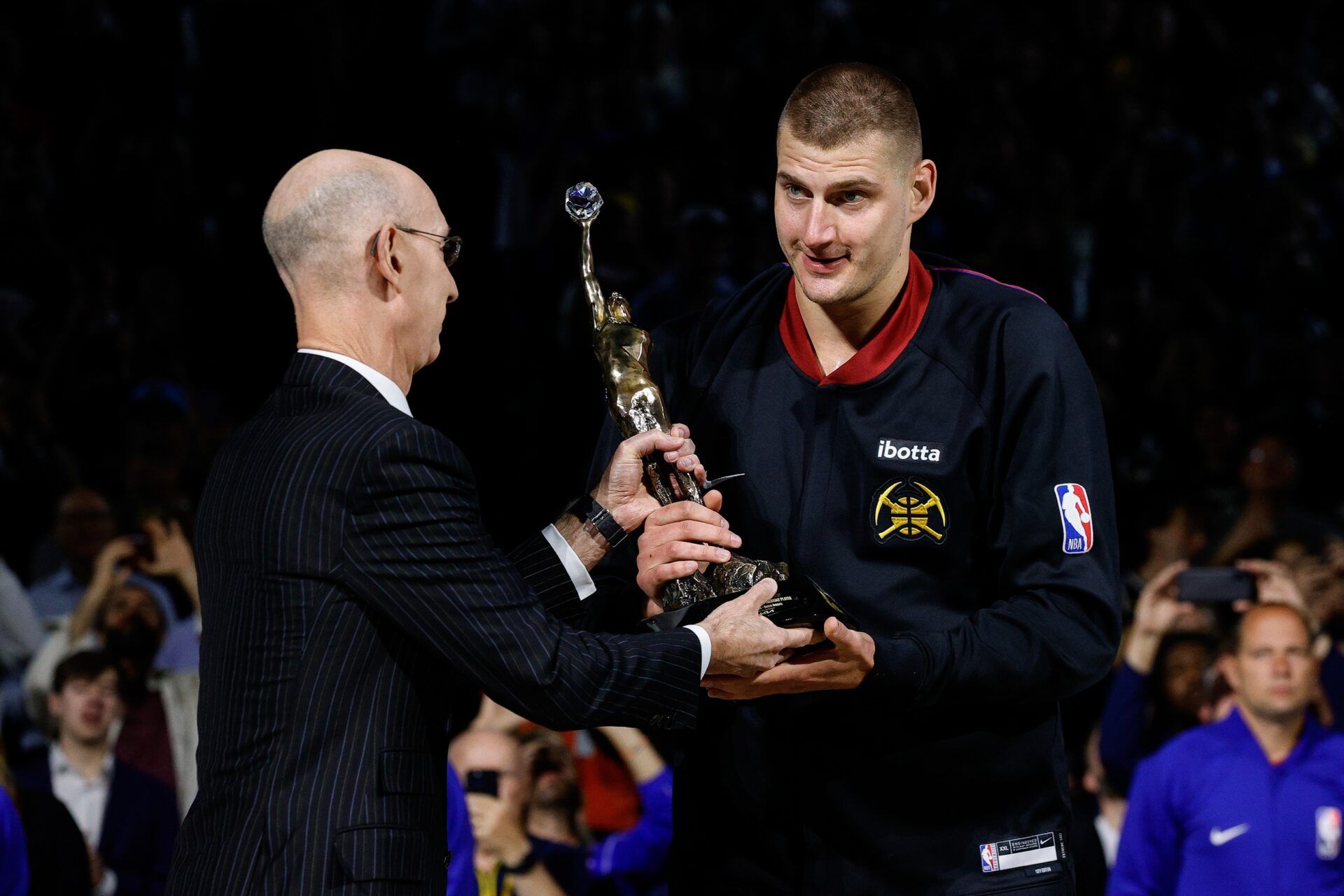 NBA commissioner Adam Silver presents Denver Nuggets center Nikola Jokic (15) the KIA NBA MVP trophy before game five against the Minnesota Timberwolves in the second round for the 2024 NBA playoffs at Ball Arena.
