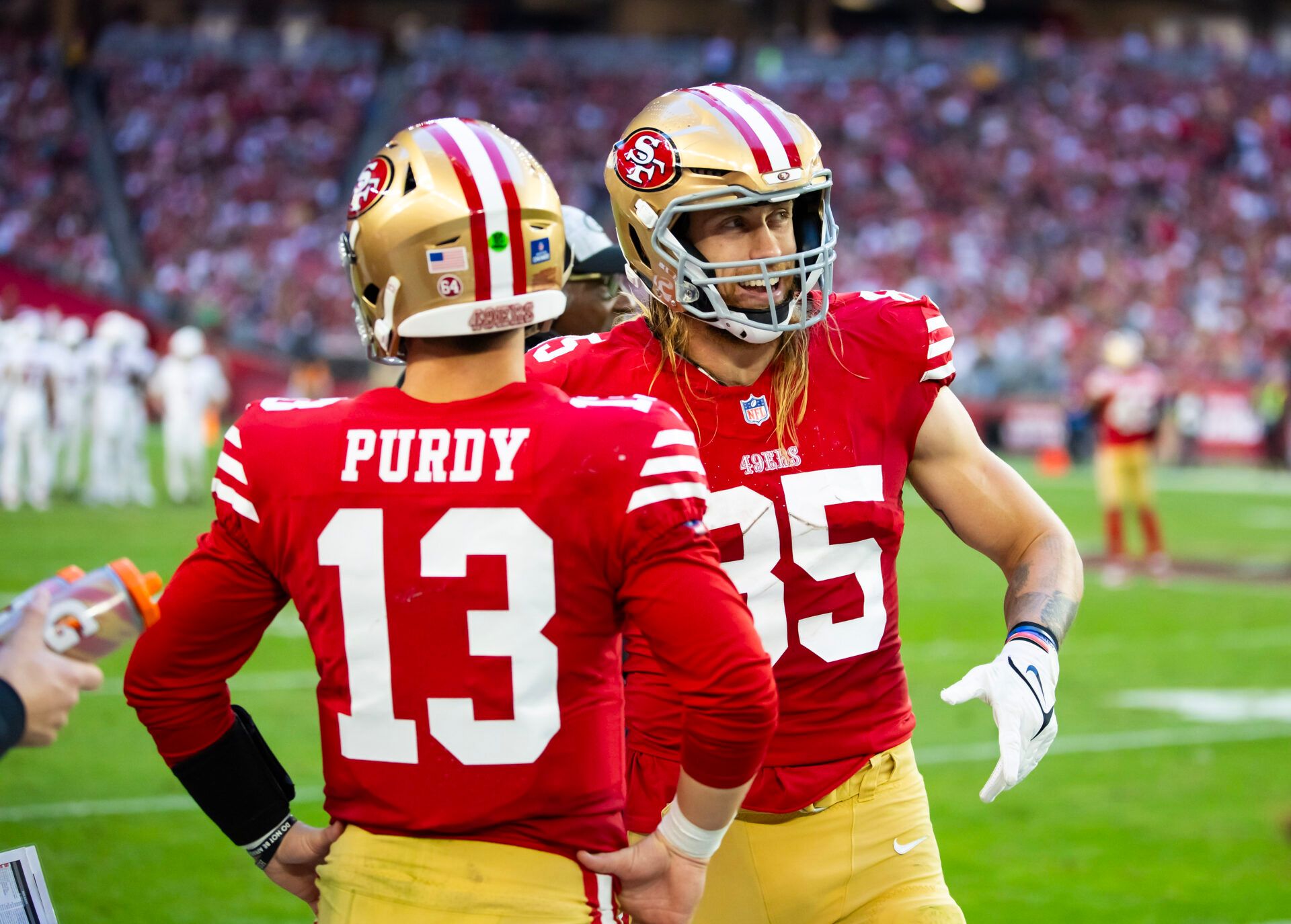 San Francisco 49ers tight end George Kittle (85) with quarterback Brock Purdy (13) against the Arizona Cardinals at State Farm Stadium.