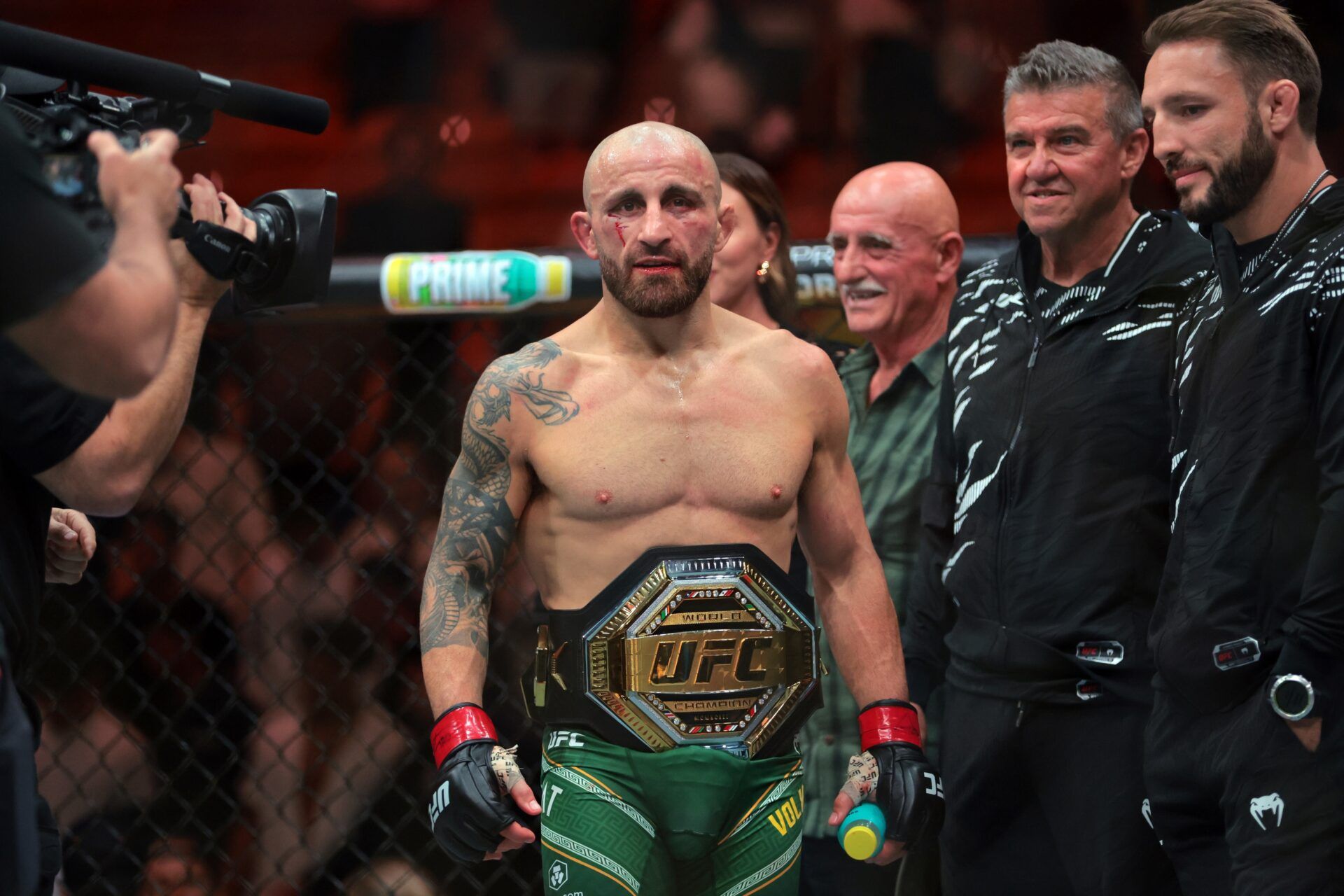 Alexander Volkanovski (red gloves) reacts after defeating Diego Lopes (not pictured) during UFC 314 at Kaseya Center.