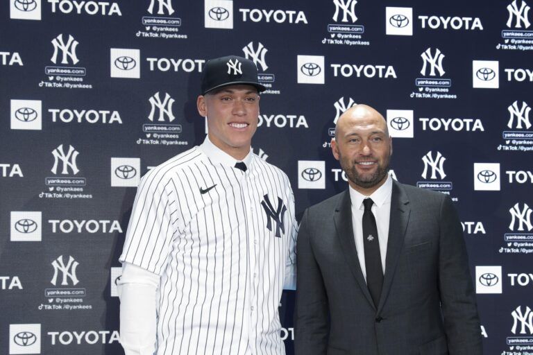 Aaron Judge poses with Derek Jeter uring a press conference at Yankee Stadium.