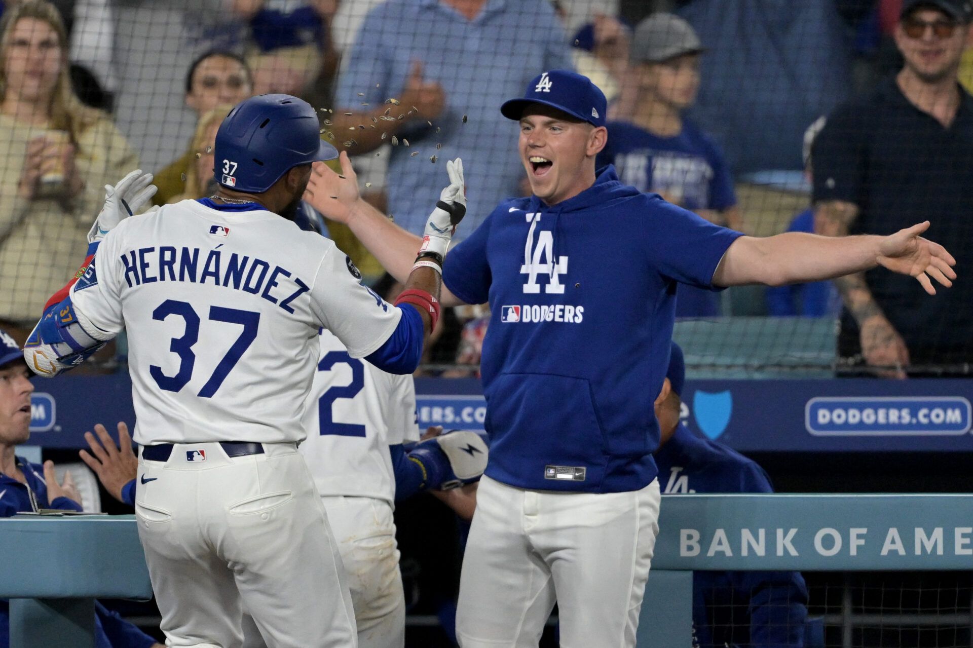 Los Angeles Dodgers right fielder Teoscar Hernandez (37) is congratulated at the dugout by catcher Will Smith (16) after hitting a three-run home run in the sixth inning against the Arizona Diamondbacks at Dodger Stadium.