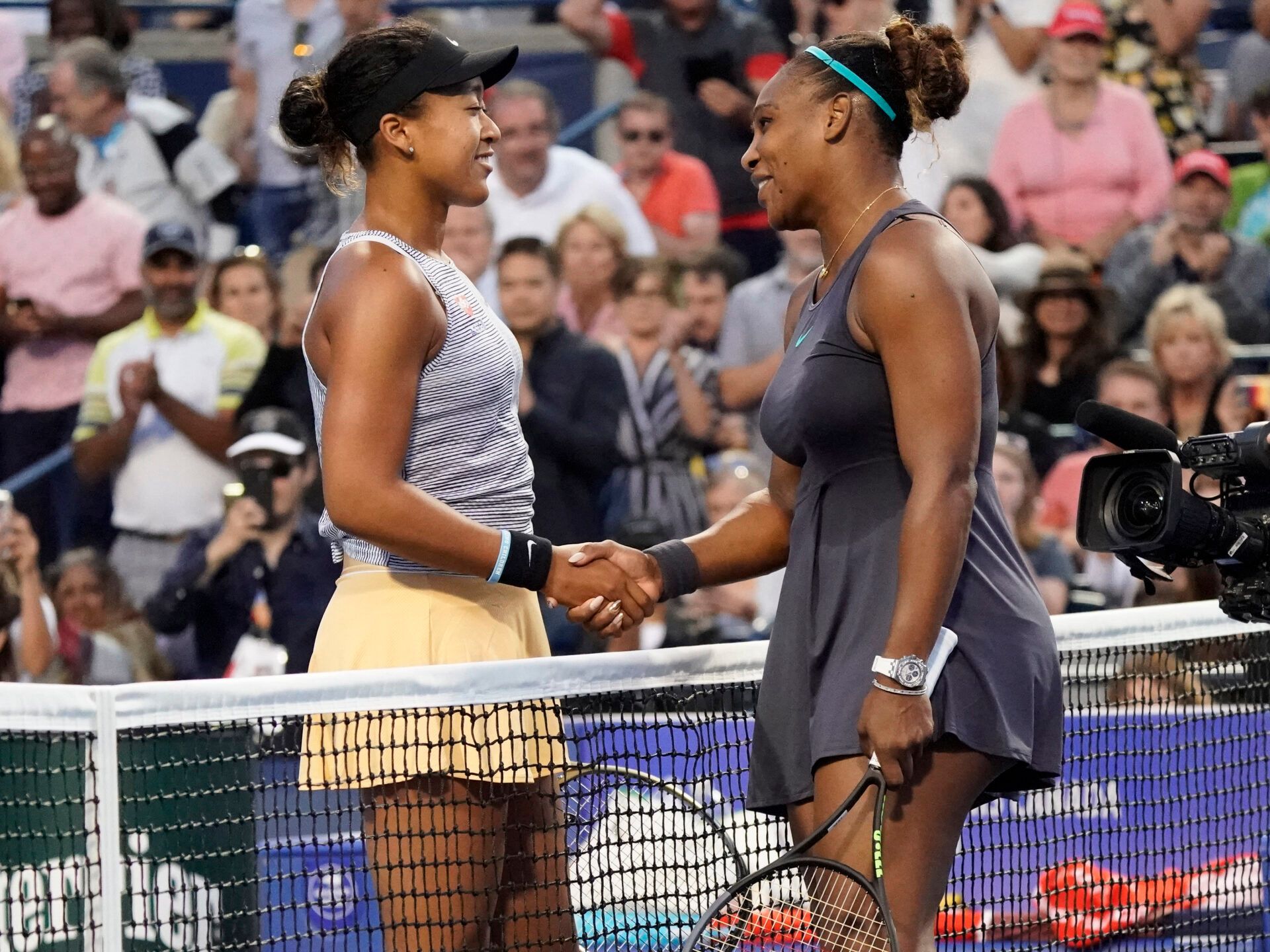 Naomi Osaka (left) congratulates Serena Williams (right) on her win during the Rogers Cup tennis tournament at Aviva Centre.