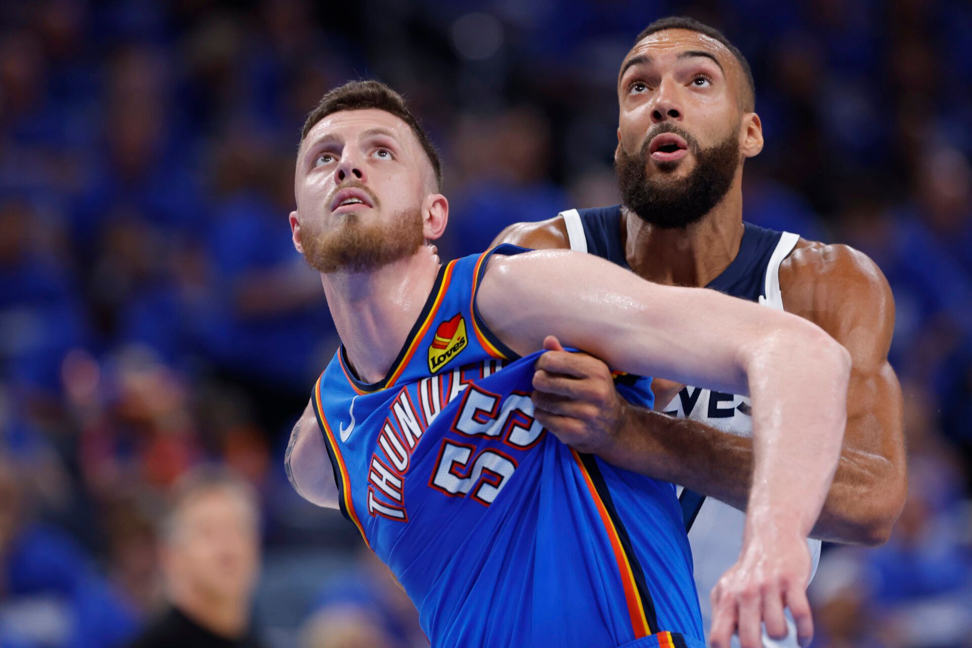 Oklahoma City Thunder center Isaiah Hartenstein (55) and Minnesota Timberwolves center Rudy Gobert (27) fight for position in the third quarter during game two of the western conference finals for the 2025 NBA Playoffs at Paycom Center.