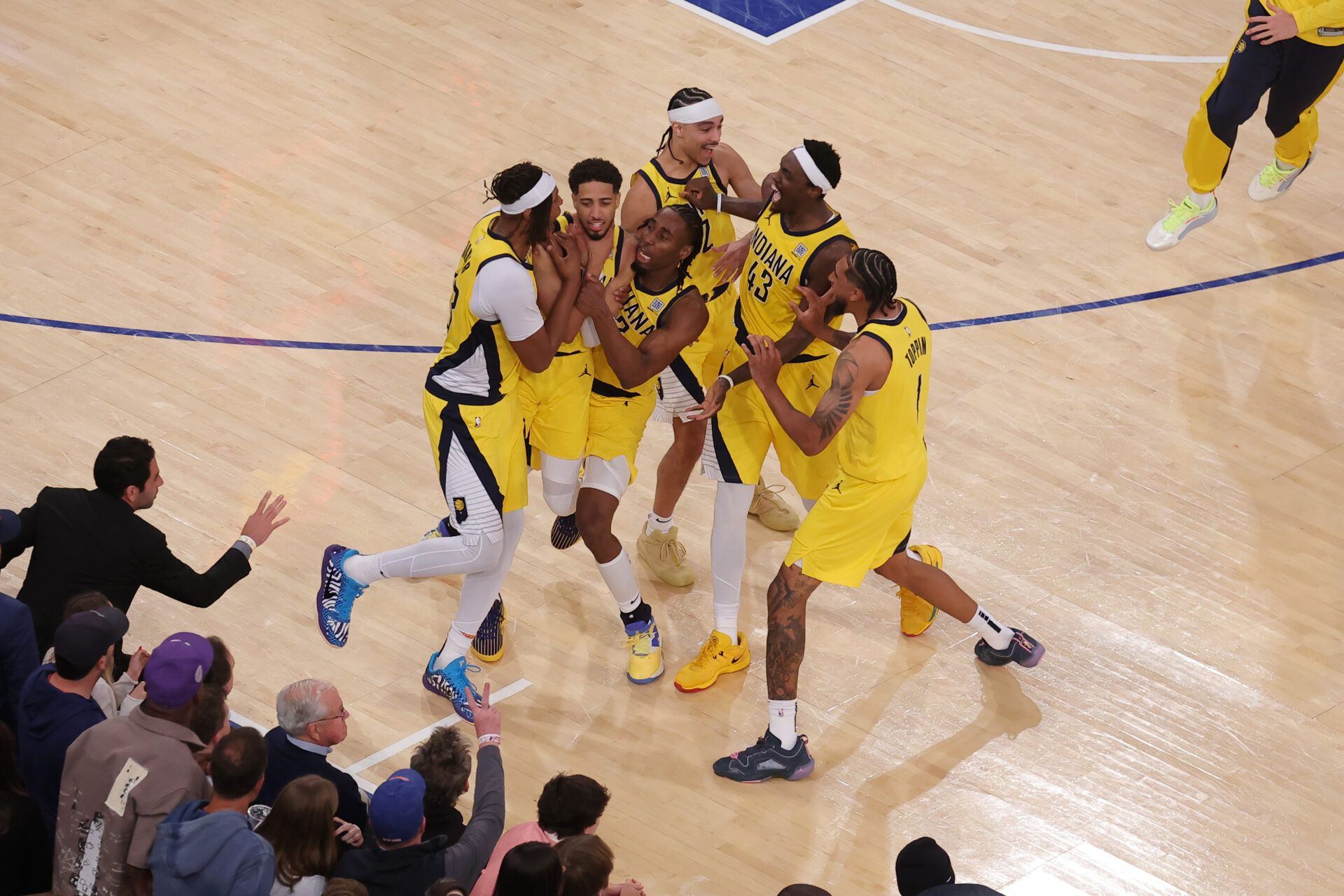 Indiana Pacers guard Tyrese Haliburton (0) celebrates with teammates after tying the game in the fourth quarter to send the game to overtime against the New York Knicks during game one of the eastern conference finals for the 2025 NBA Playoffs at Madison Square Garden.