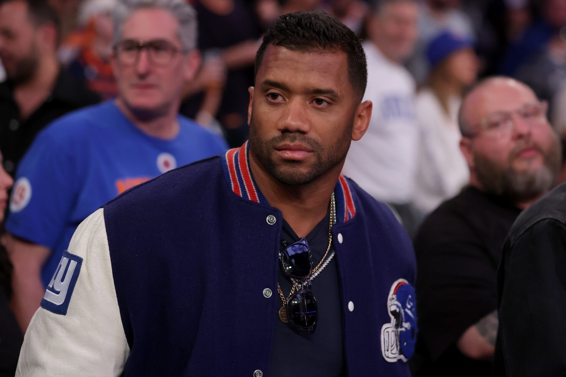 New York Giants quarterback Russell Wilson stands courtside during the fourth quarter of game six in the second round of the 2025 NBA Playoffs between the New York Knicks and the Boston Celtics at Madison Square Garden.