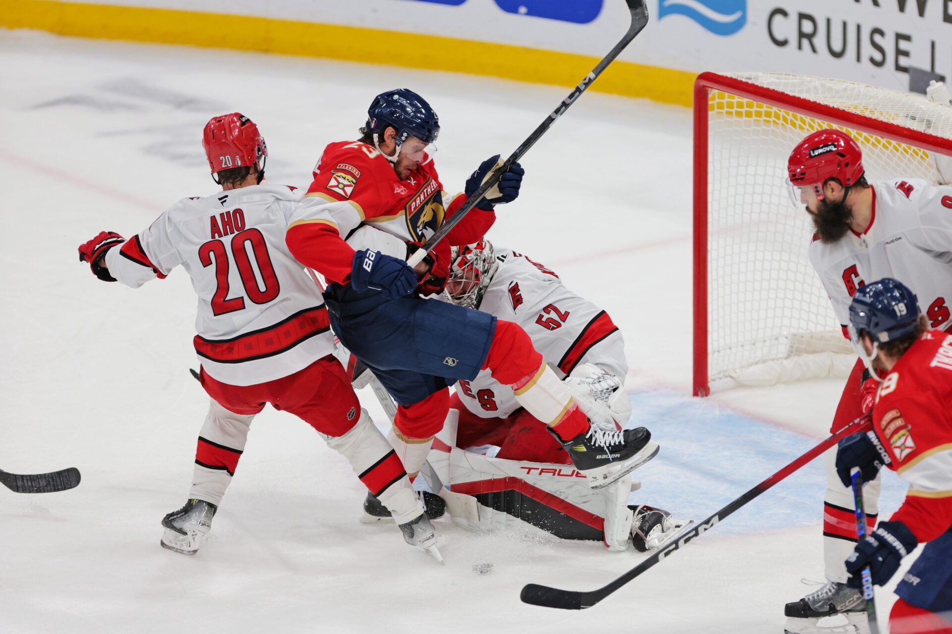 Florida Panthers left wing Matthew Tkachuk (19) moves the puck as Carolina Hurricanes goaltender Pyotr Kochetkov (52) defends during the second period in game three of the Eastern Conference Final of the 2025 Stanley Cup Playoffs at Amerant Bank Arena.