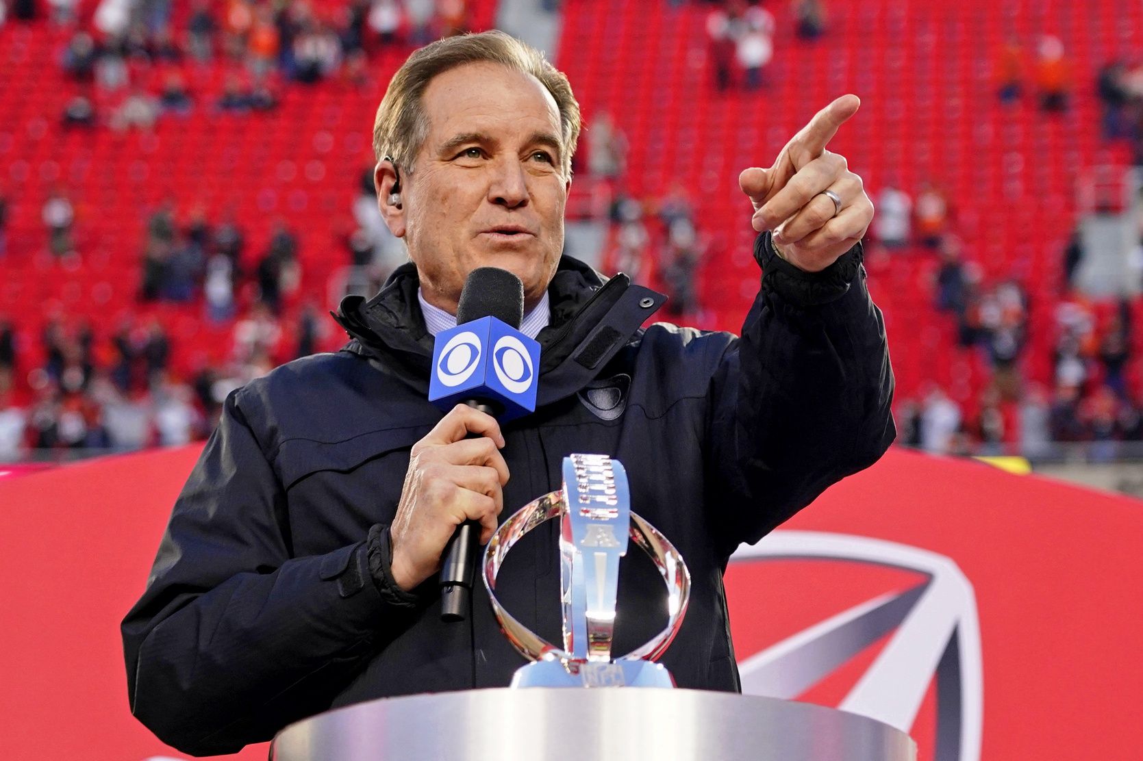 CBS personality Jim Nantz presents the Lamar Hunt trophy the AFC Championship Game between the Cincinnati Bengals and Kansas City Chiefs at GEHA Field at Arrowhead Stadium. The Cincinnati Bengals won 27-24