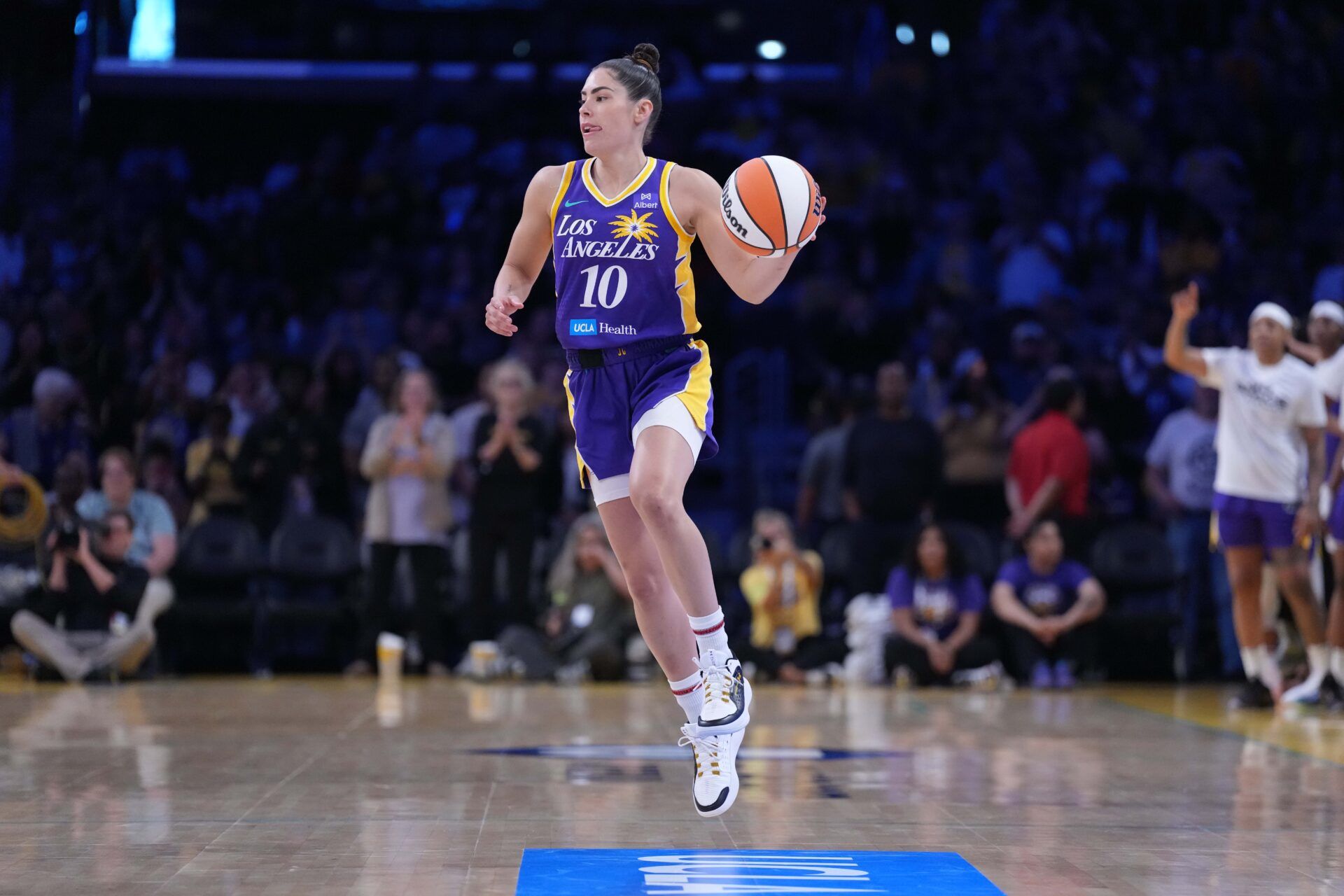 LA Sparks guard Kelsey Plum (10) dribbles the ball against the Chicago Sky in the first half at Crypto.com Arena.