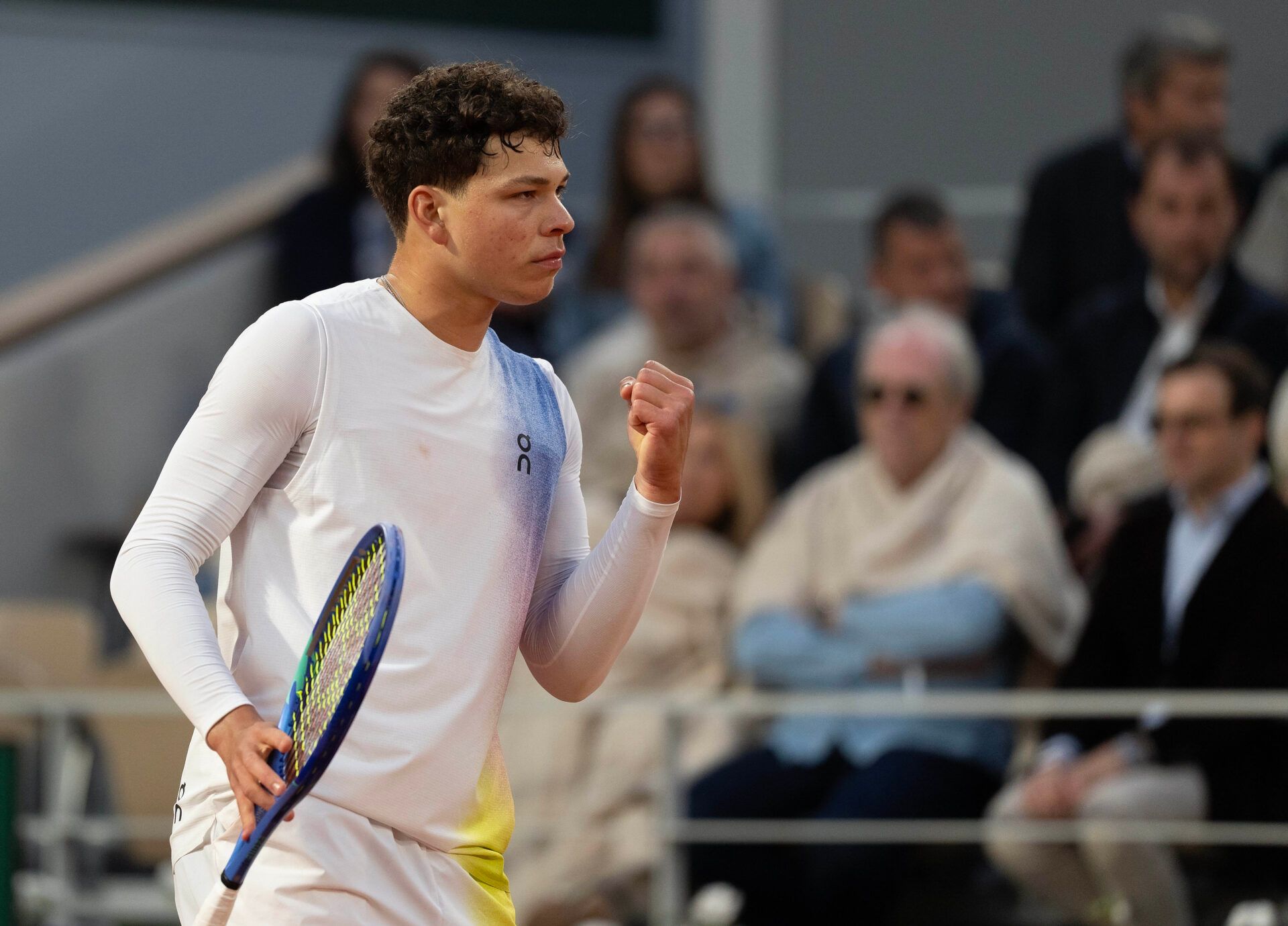 Ben Shelton of the United States reacts to a point during his match against Lorenzo Sonego of Italy on day one at Roland Garros Stadium.