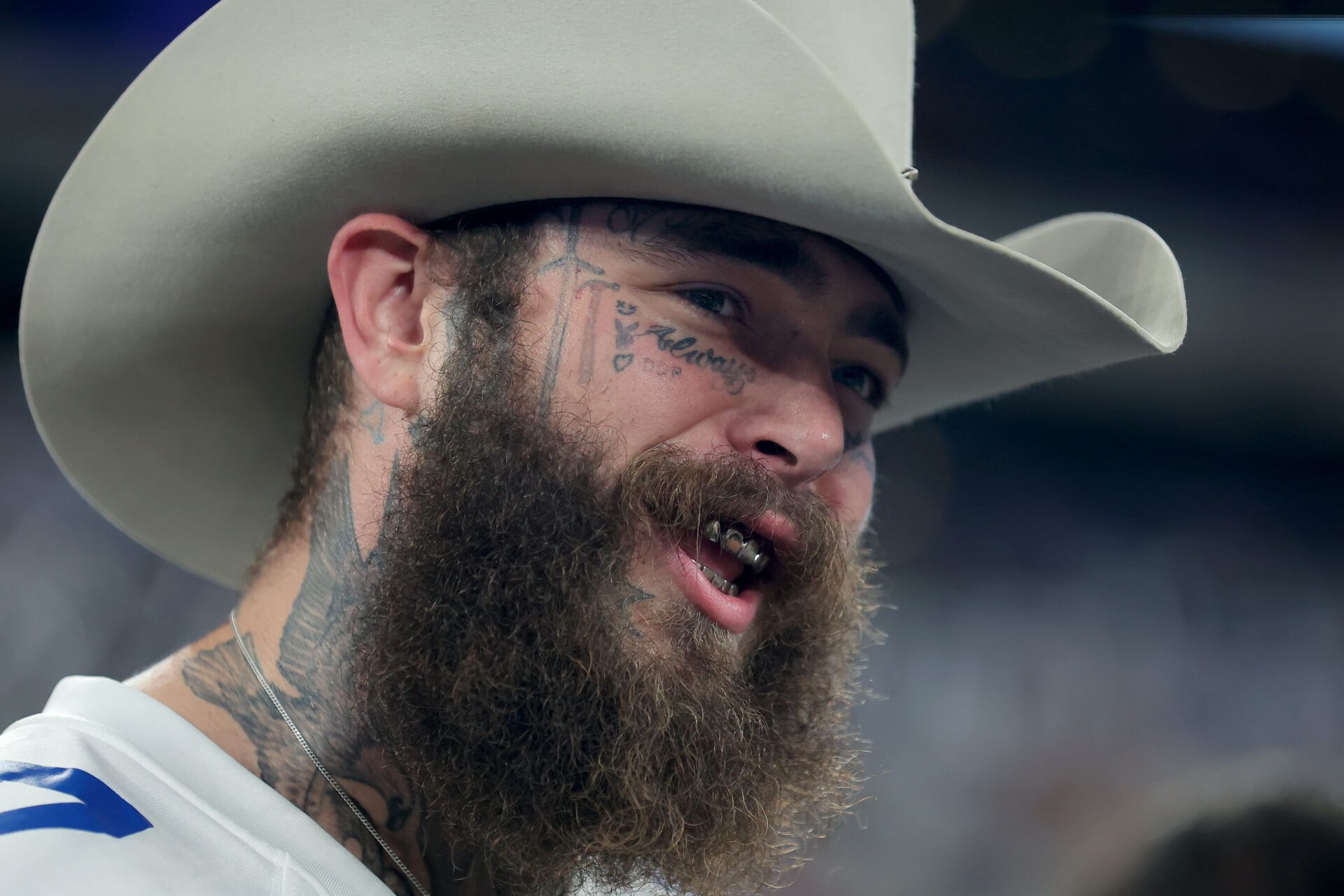American recording artist Post Malone on the field before a game between the New York Giants and the Dallas Cowboys at MetLife Stadium.
