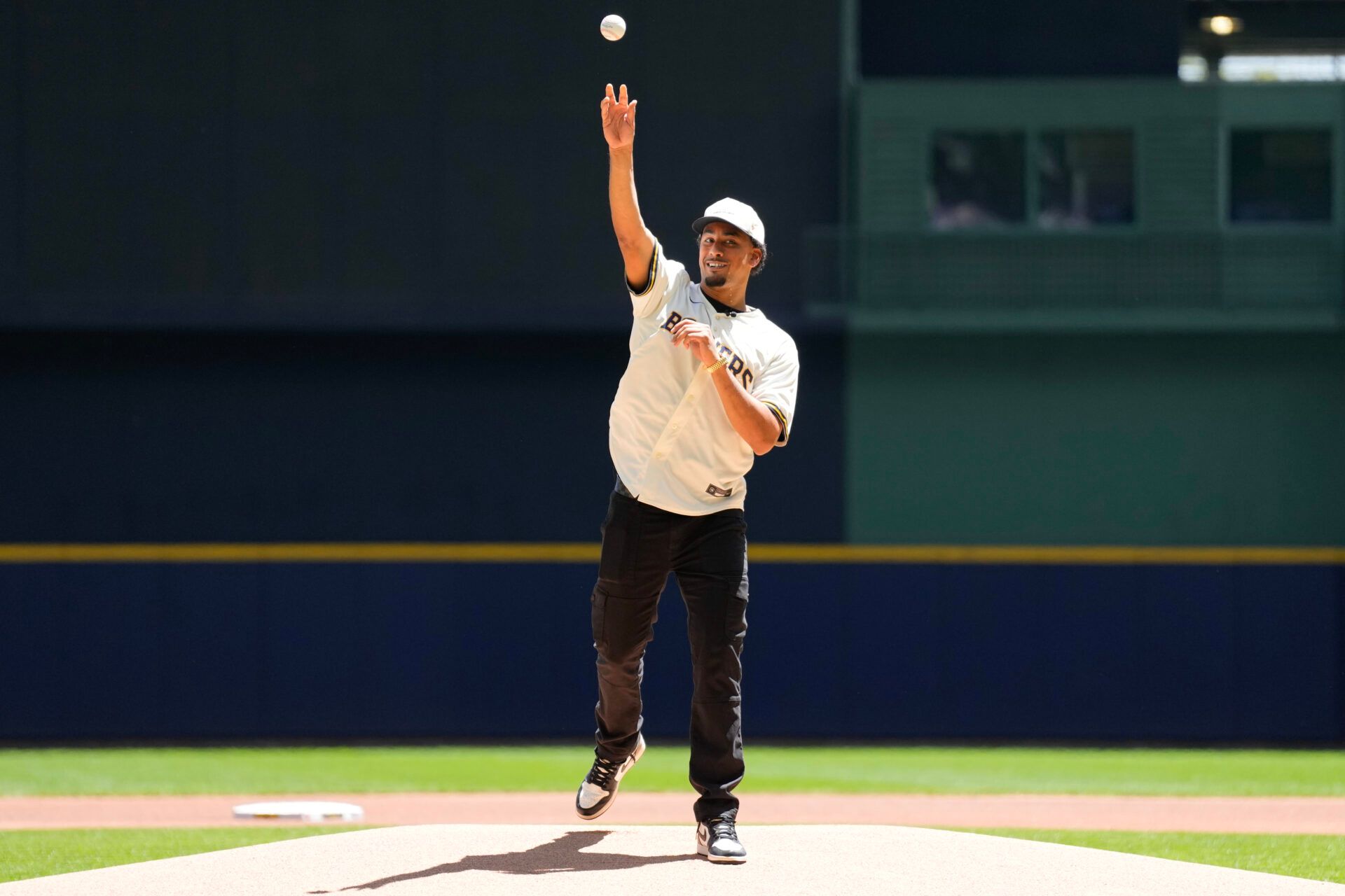 Green Bay Packers quarterback Jordan Love throws out a first pitch prior to the game between the Boston Red Sox and Milwaukee Brewers at American Family Field.