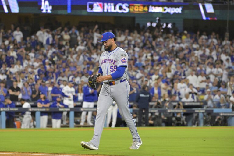 New York Mets pitcher Sean Manaea (59) walks to the dugout after being relieved in the third inning against the Los Angeles Dodgers during game six of the NLCS for the 2024 MLB playoffs at Dodger Stadium.