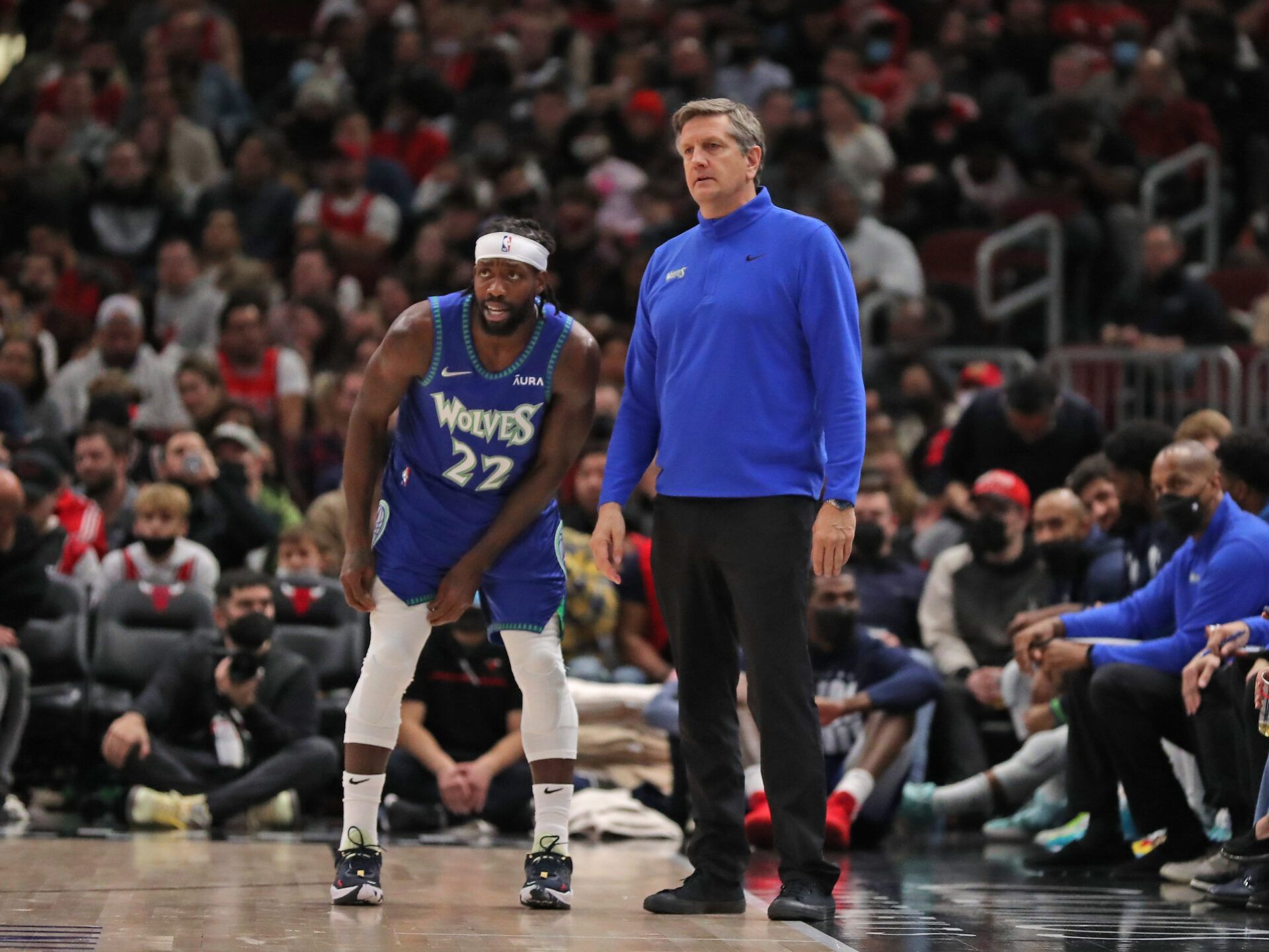 Minnesota Timberwolves guard Patrick Beverley (22) talks with coach Chris Finch during the second half against the Chicago Bulls at the United Center.