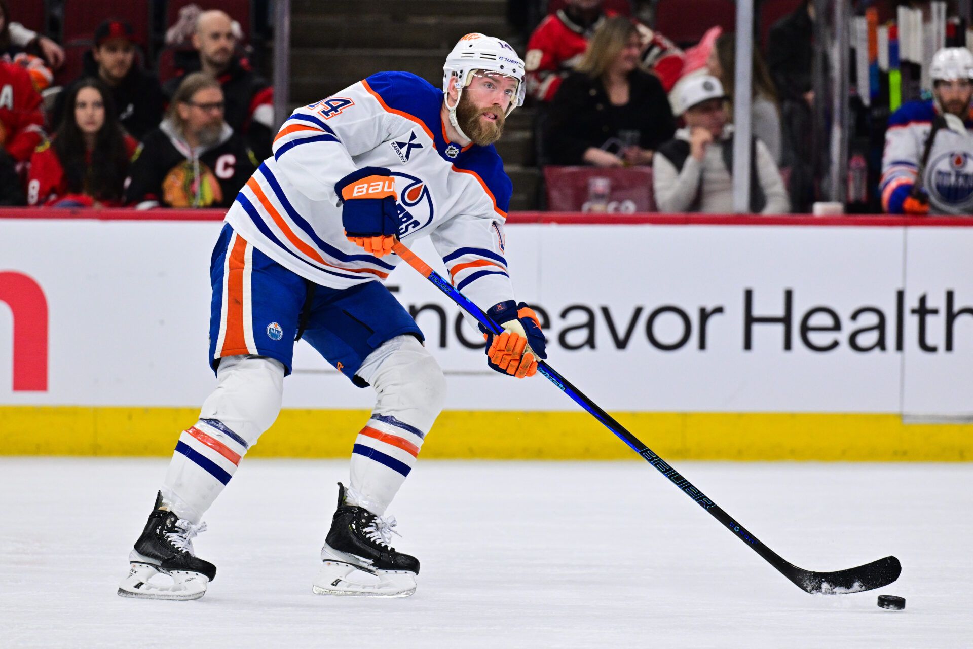 Edmonton Oilers defenseman Mattias Ekholm (14) skates with the puck against the Chicago Blackhawks during the first period at the United Center.