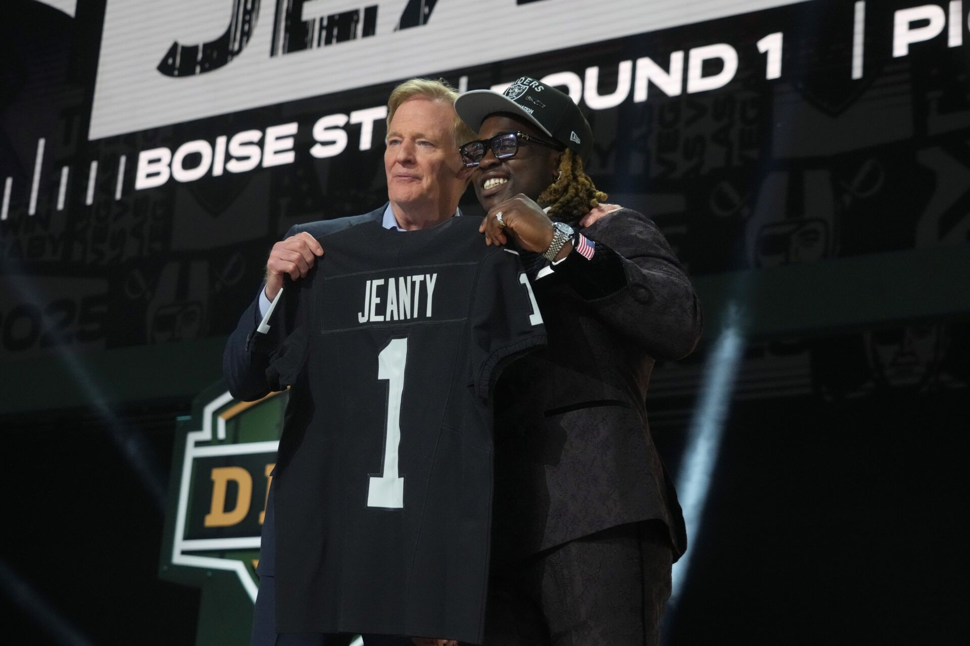 NFL commissioner Roger Goodell with Boise State Broncos running back Ashton Jeanty after he is selected by the Las Vegas Raiders as the number six pick in the first round of the 2025 NFL Draft at Lambeau Field.