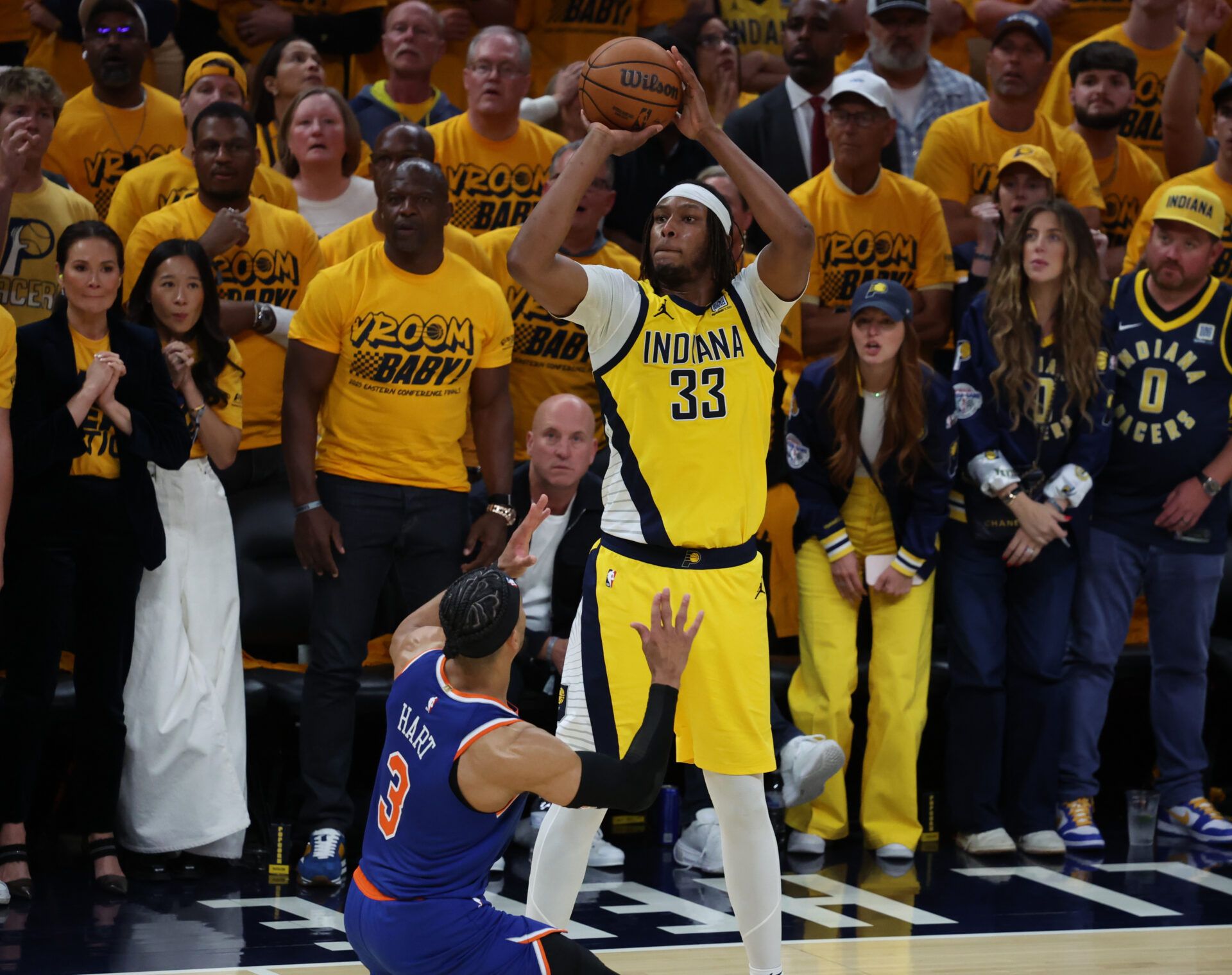 Indiana Pacers center Myles Turner (33) shoots a three point basket over New York Knicks guard Josh Hart (3) during the fourth quarter of game three of the eastern conference finals for the 2025 NBA Playoffs at Gainbridge Fieldhouse.