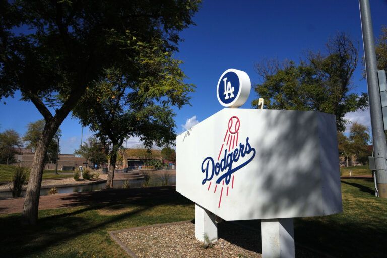 Los Angeles Dodgers logo signage on display during a Spring Training workout at Camelback Ranch.