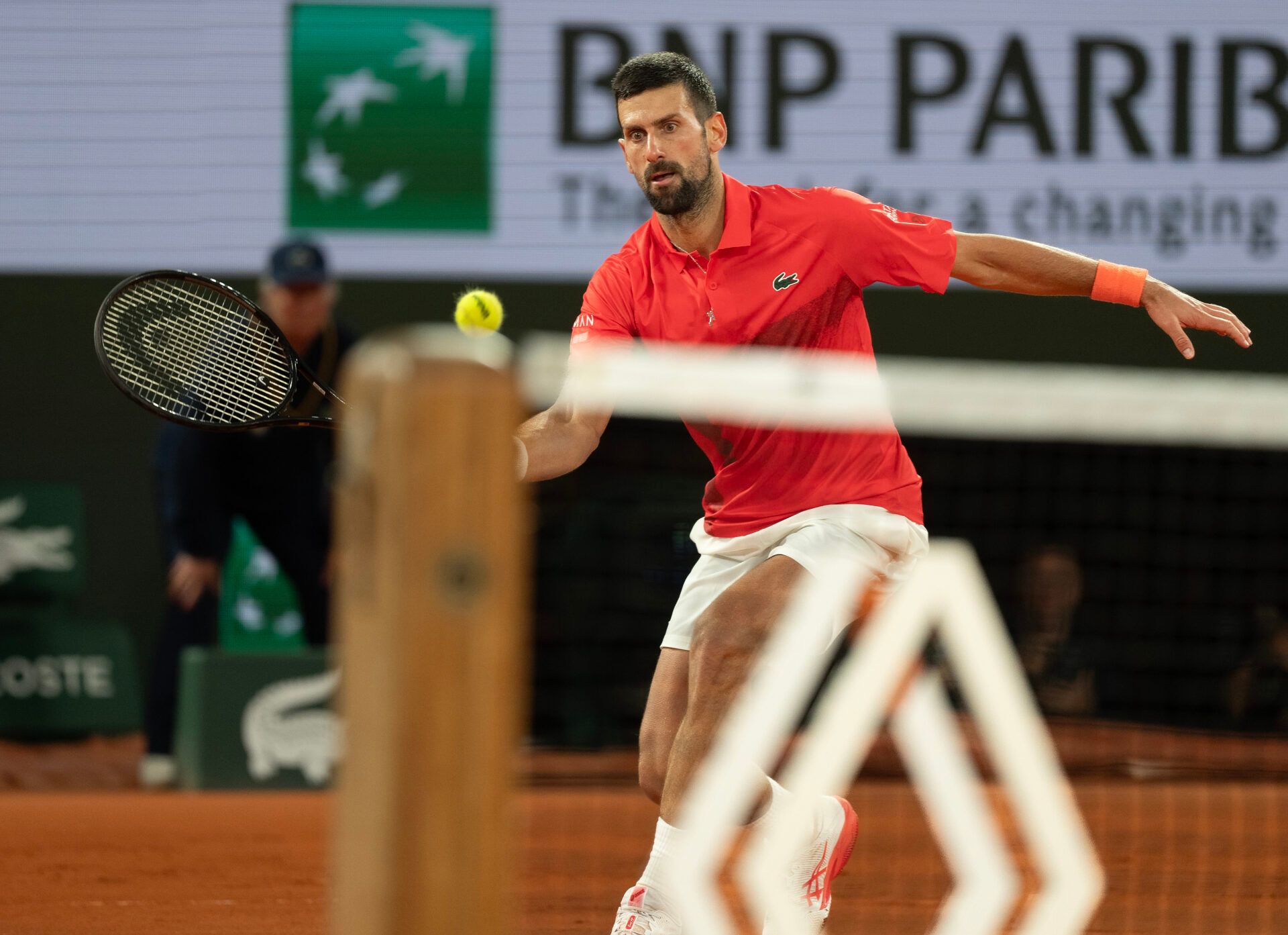 Novak Djokovic of Serbia returns a shot during his match against Mackenzie Mcdonald of the United States  on day three at Roland Garros Stadium.
