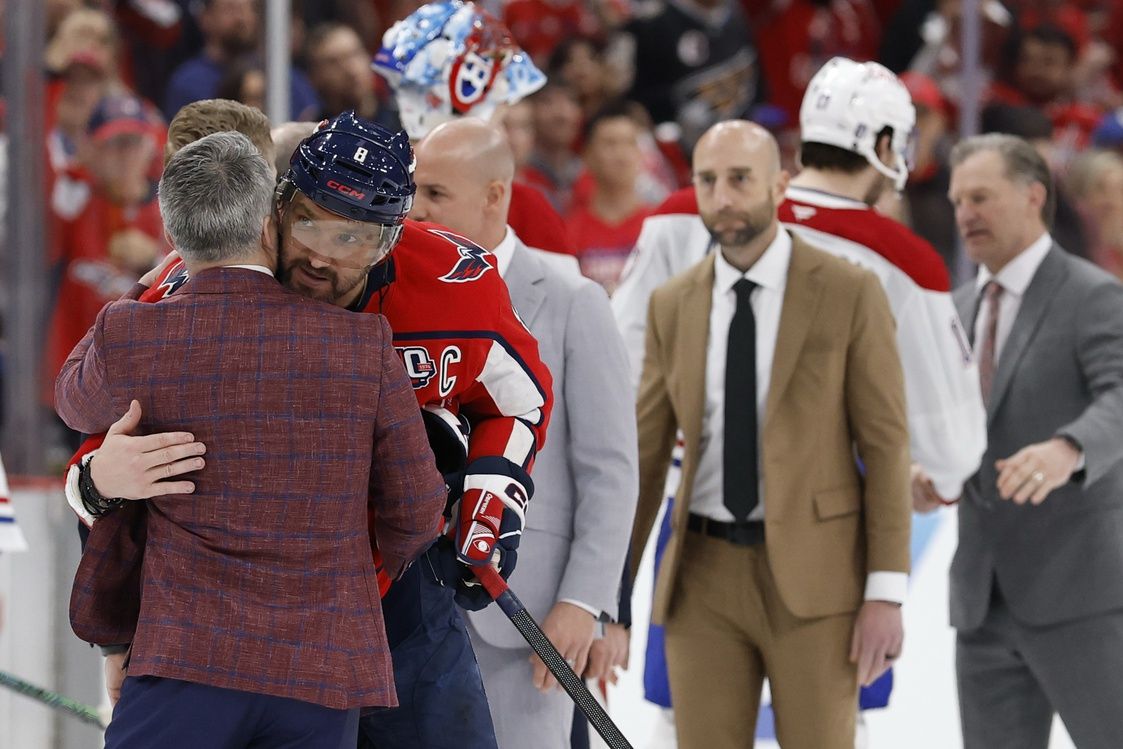 Montreal Canadiens head coach Martin St. Louis (L) hugs Washington Capitals left wing Alex Ovechkin (8) in the handshake line after game five of the first round of the 2025 Stanley Cup Playoffs at Capital One Arena.