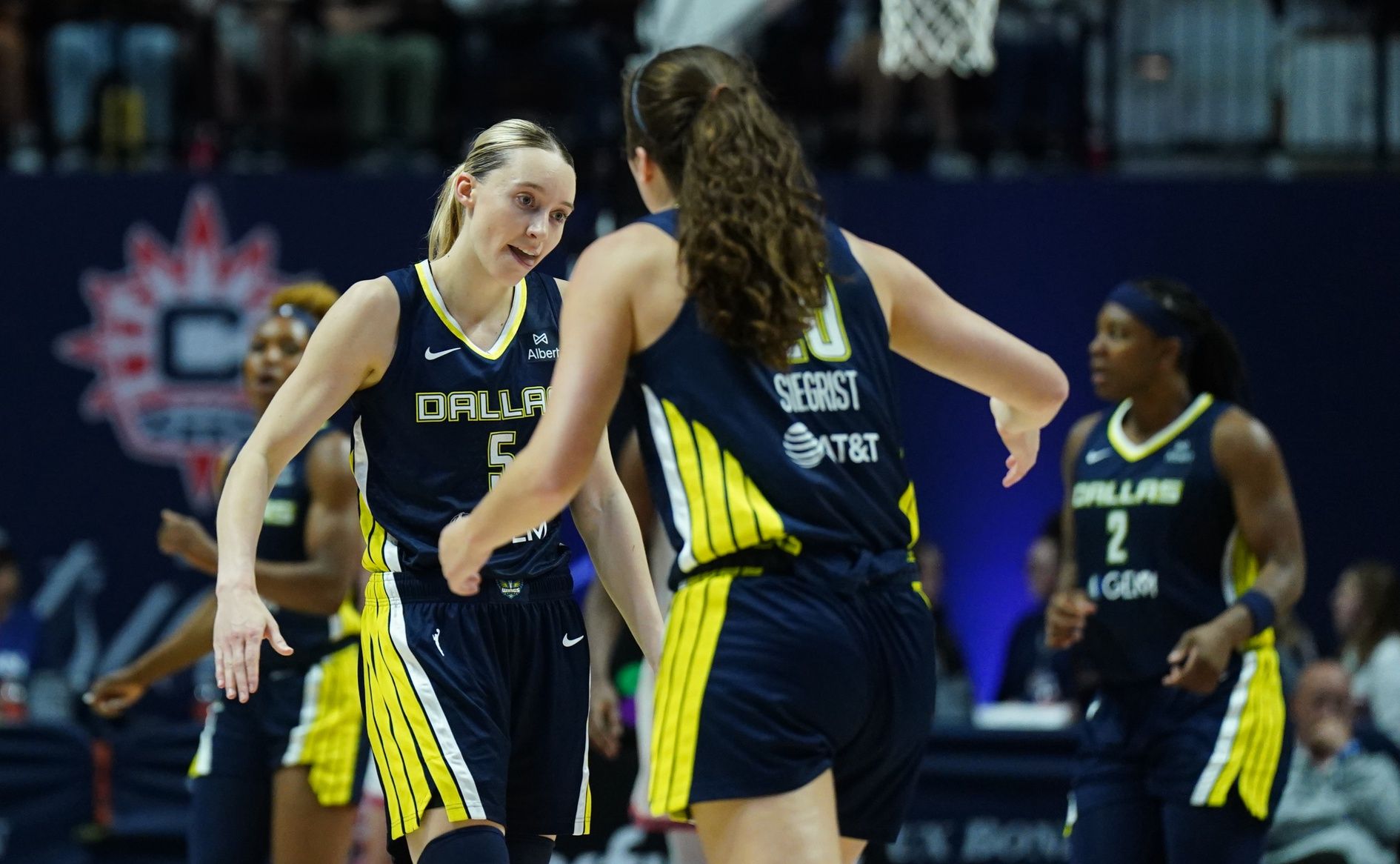 Dallas Wings guard Paige Bueckers (5) and forward Maddy Siegrist (20) react after a play against the Connecticut Sun in the second half at Mohegan Sun Arena.