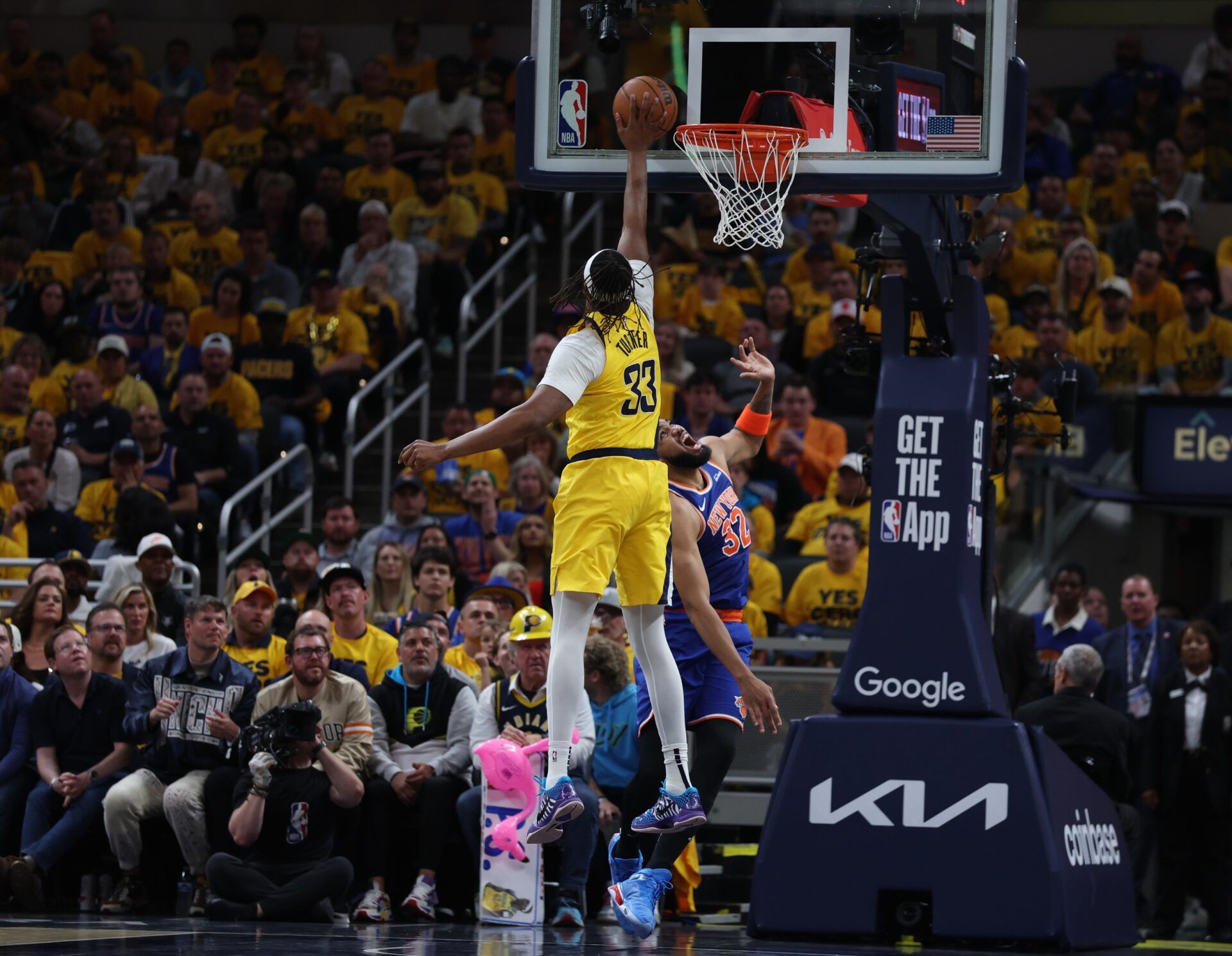 Indiana Pacers center Myles Turner (33) shoots a layup over New York Knicks center Karl-Anthony Towns (32) during the second quarter of game four of the eastern conference finals for the 2025 NBA Playoffs at Gainbridge Fieldhouse.