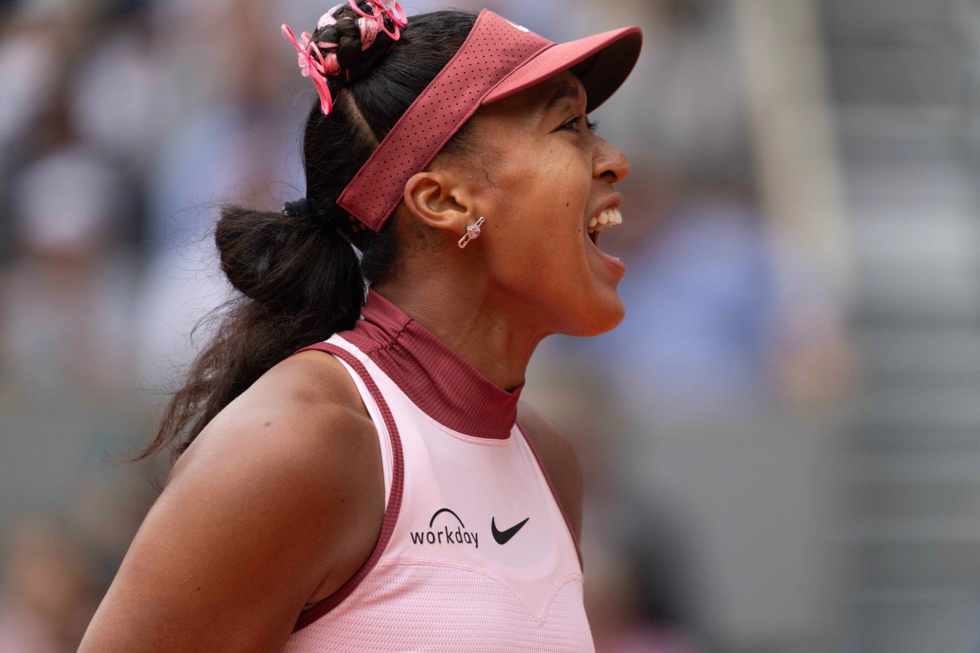 Naomi Osaka of Japan reacts to a point during her match against Paula Badosa of Spain on day two at Roland Garros Stadium.