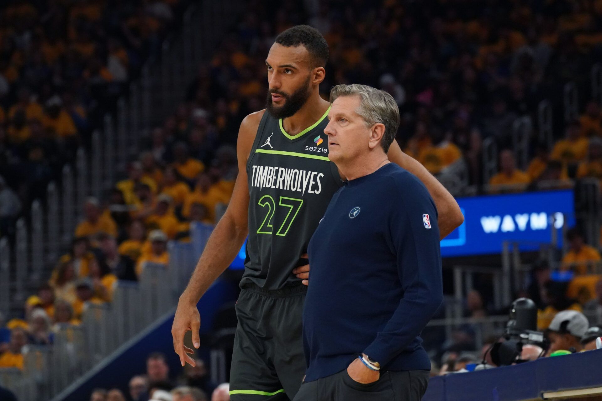Minnesota Timberwolves center Rudy Gobert (27) talks with Minnesota Timberwolves head coach Chris Finch in the second quarter against the Golden State Warriors during game three in the second round of the 2025 NBA Playoffs at Chase Center.