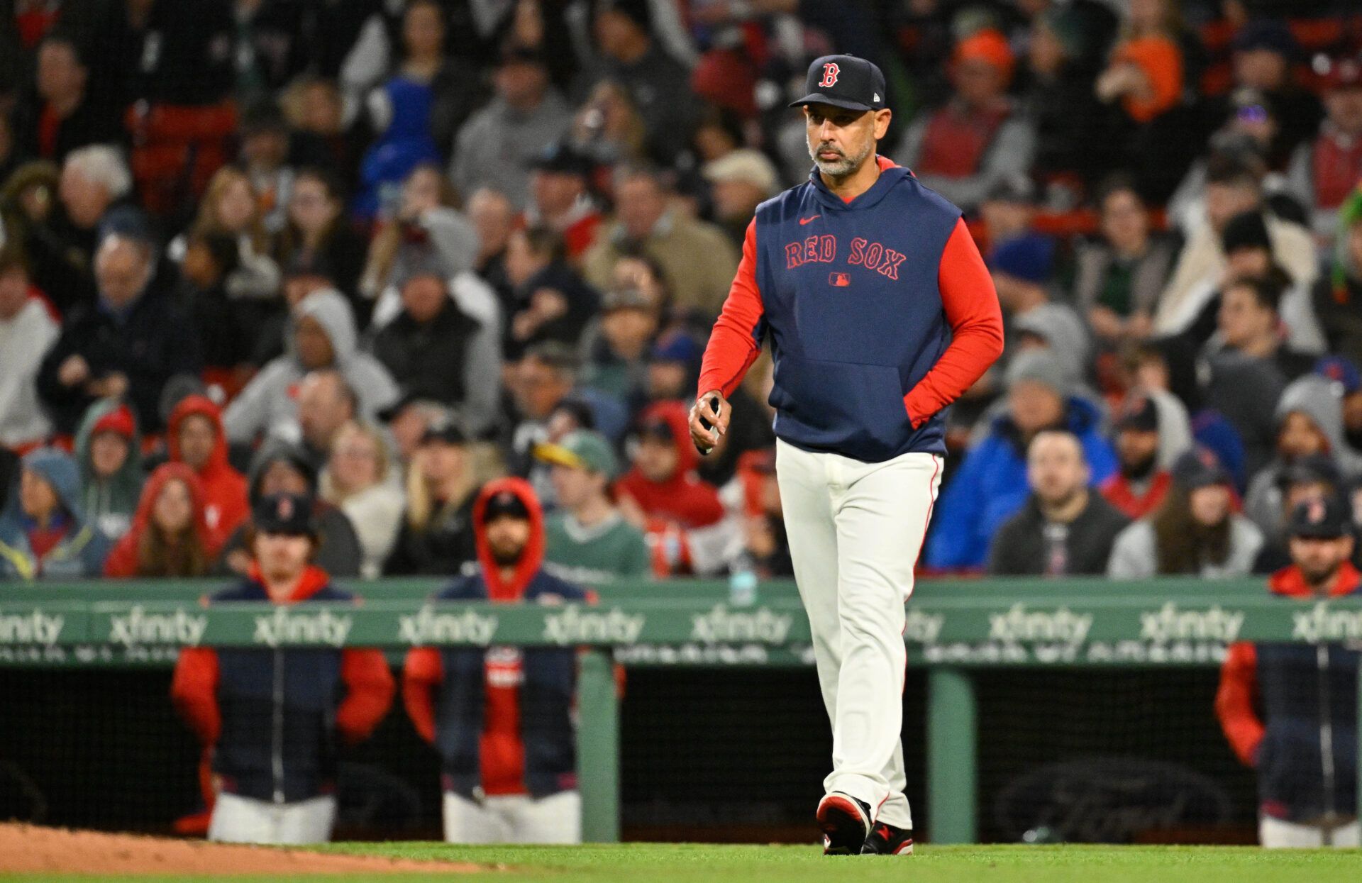 Boston Red Sox manager Alex Cora (13) walks to the mound during the sixth inning against the New York Mets at Fenway Park.