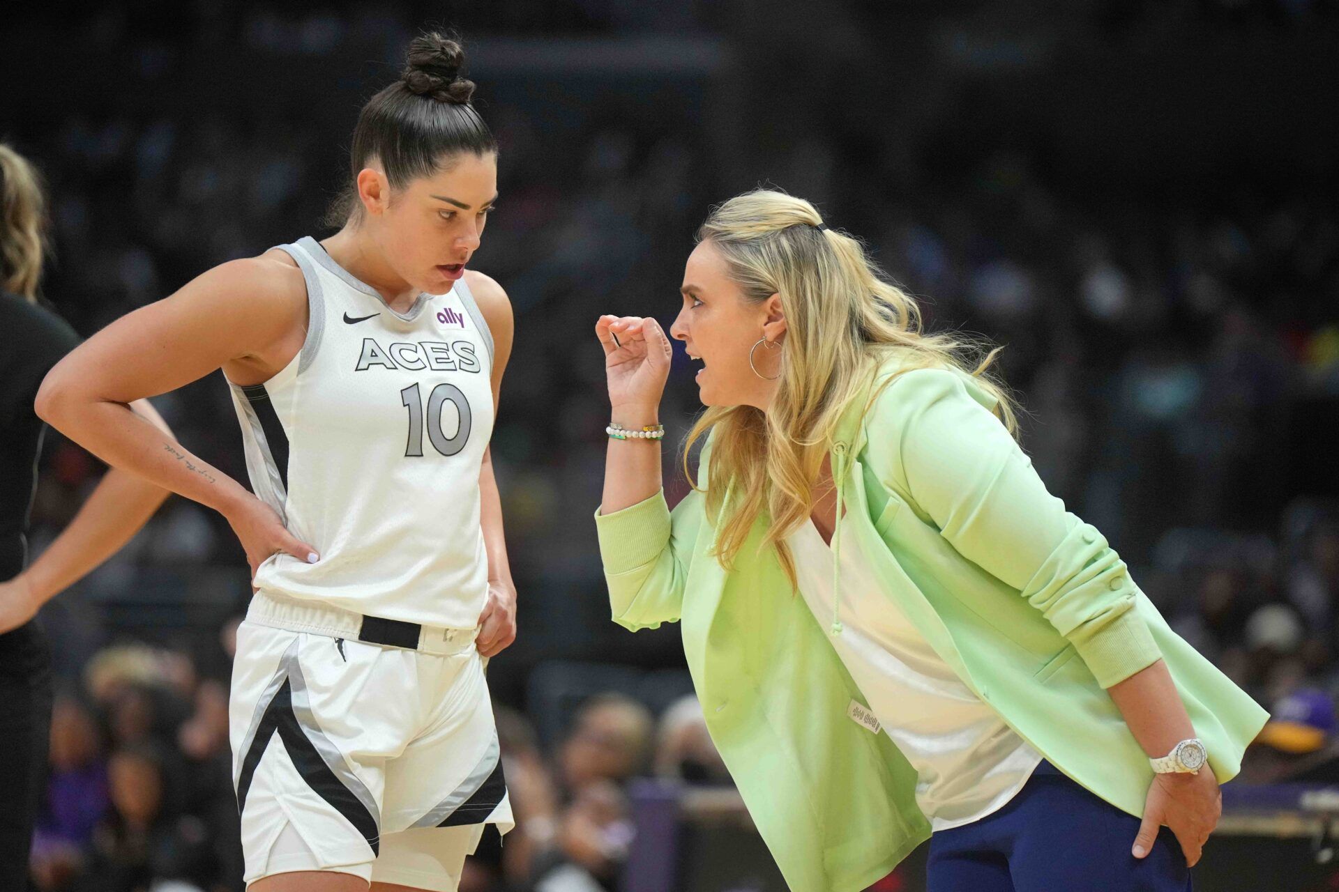 Las Vegas Aces coach Becky Hammon (right) talks with guard Kelsey Plum (10) in the second half against the LA Sparks at Crypto.com Arena.