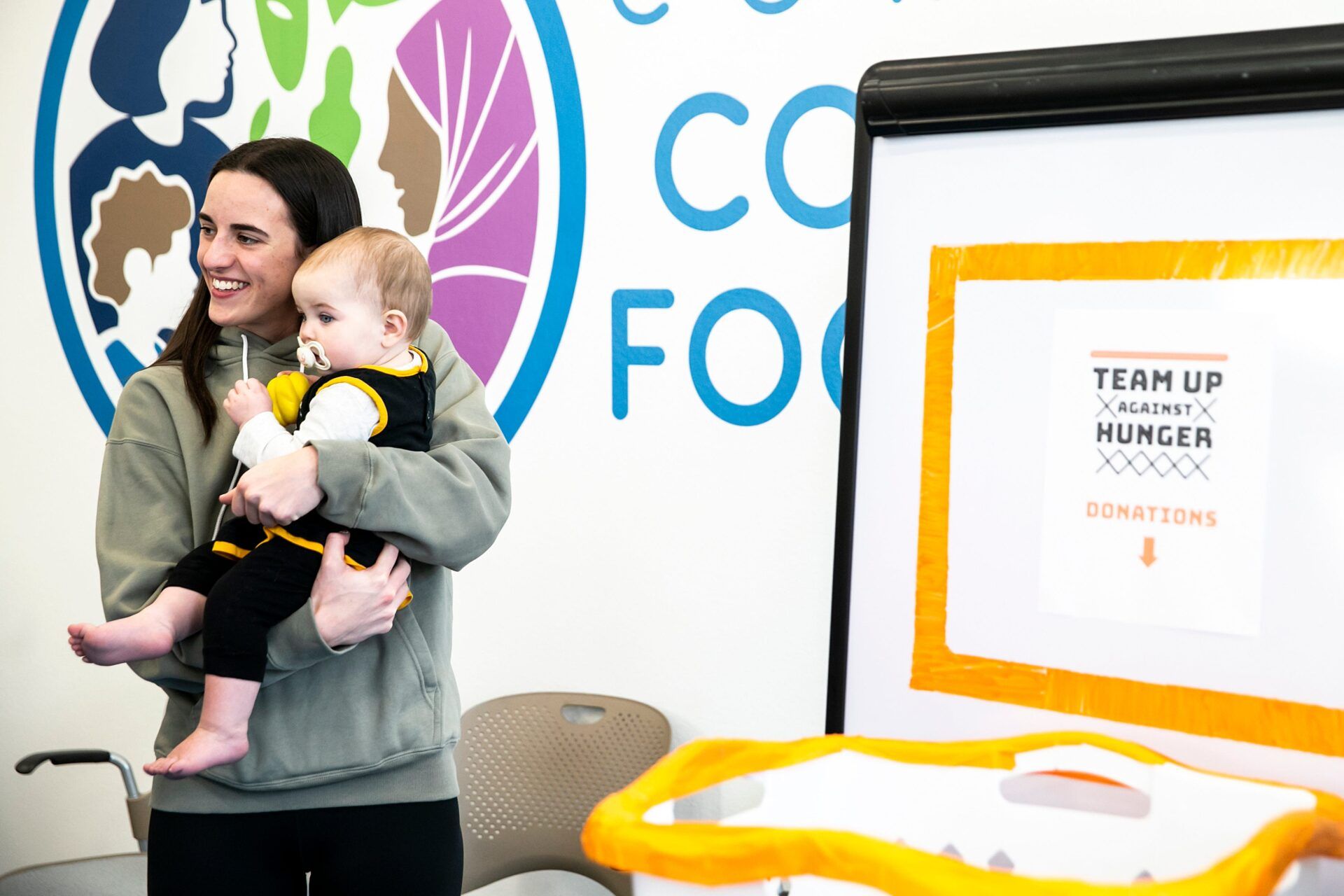 WATCH: Caitlin Clark Arrives at Fever-Mystics Game on Baby Duty While  Sidelined With Quad Injury