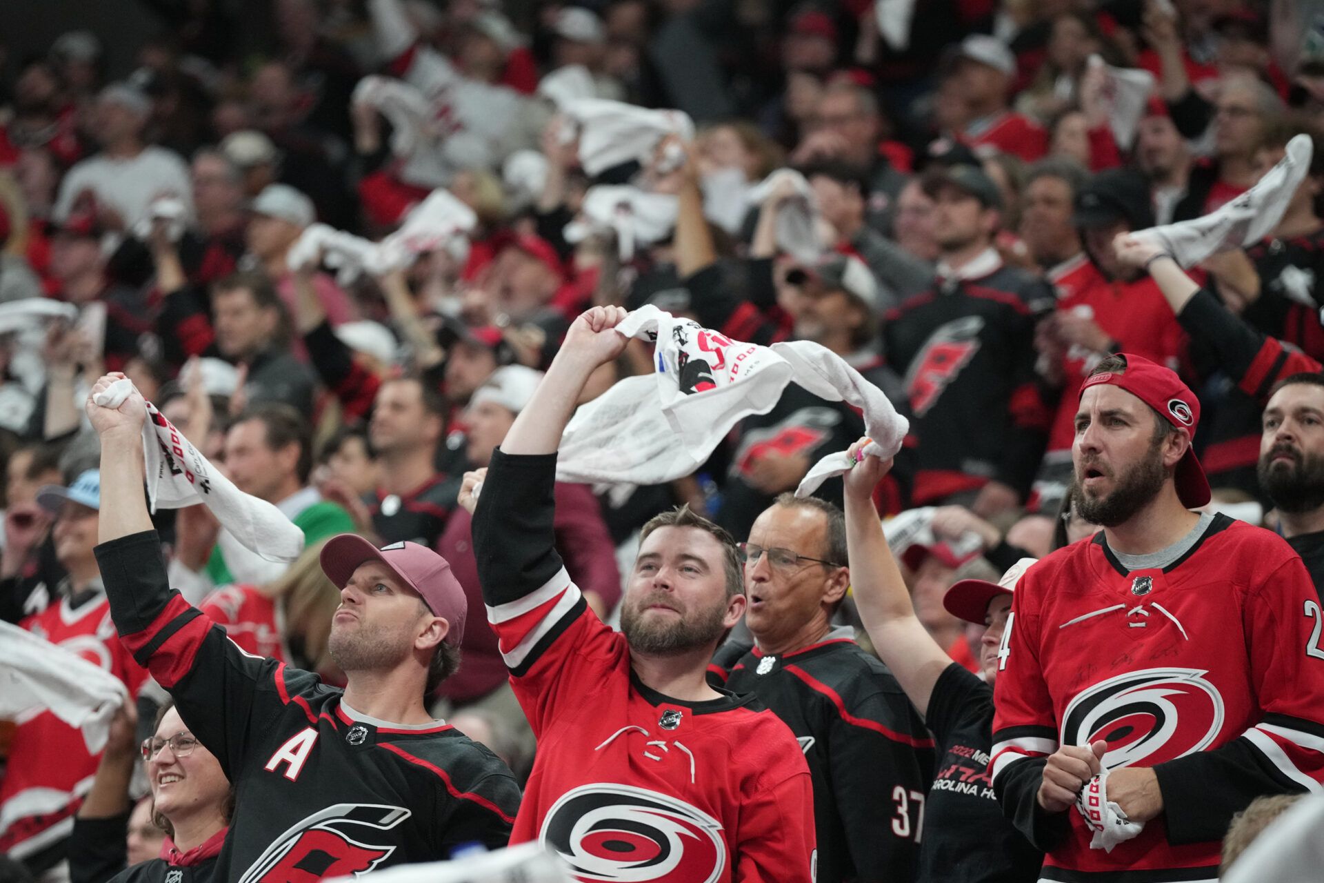 Carolina Hurricanes fans celebrate a goal during the third period against the Florida Panthers in game five of the Eastern Conference Final of the 2025 Stanley Cup Playoffs at Lenovo Center.