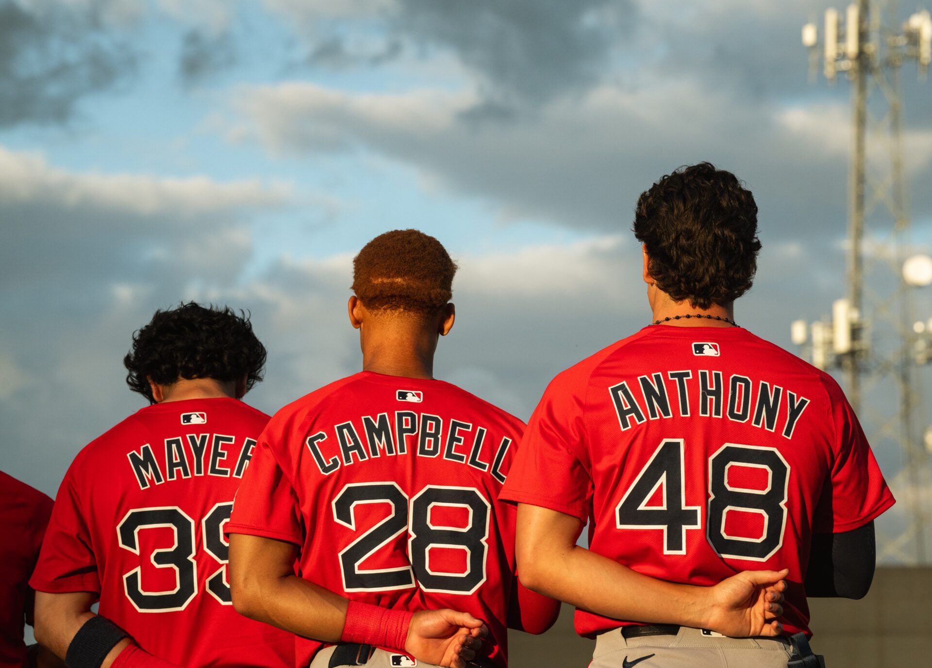Boston's top-three prospects in Marcelo Mayer, Kristian Campbell and Roman Anthony stand for the national anthem ahead of a Spring Training breakout game on March 13, 2025.