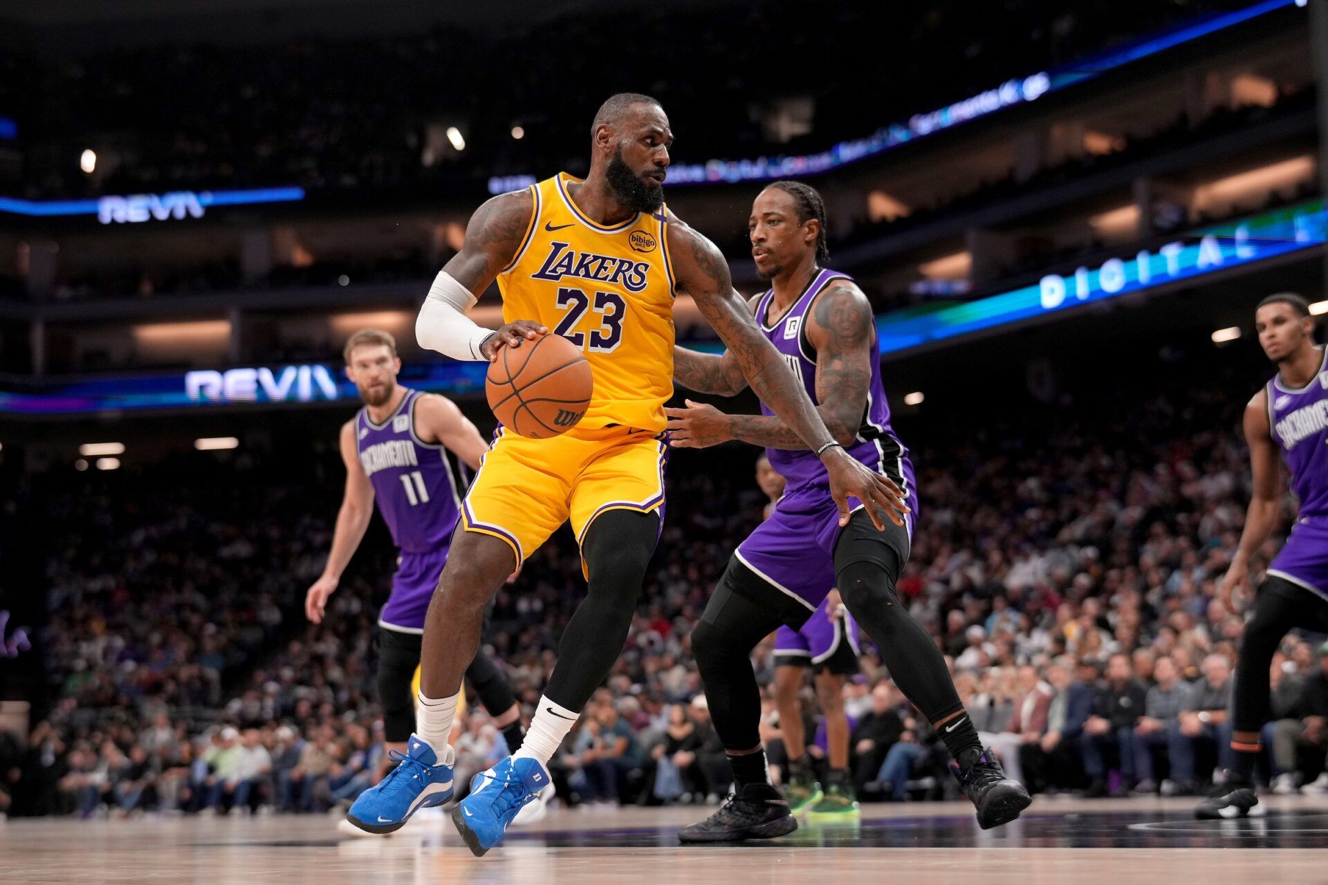 Los Angeles Lakers forward LeBron James (23) dribbles the ball next to Sacramento Kings guard DeMar DeRozan (10) in the first quarter at the Golden 1 Center.