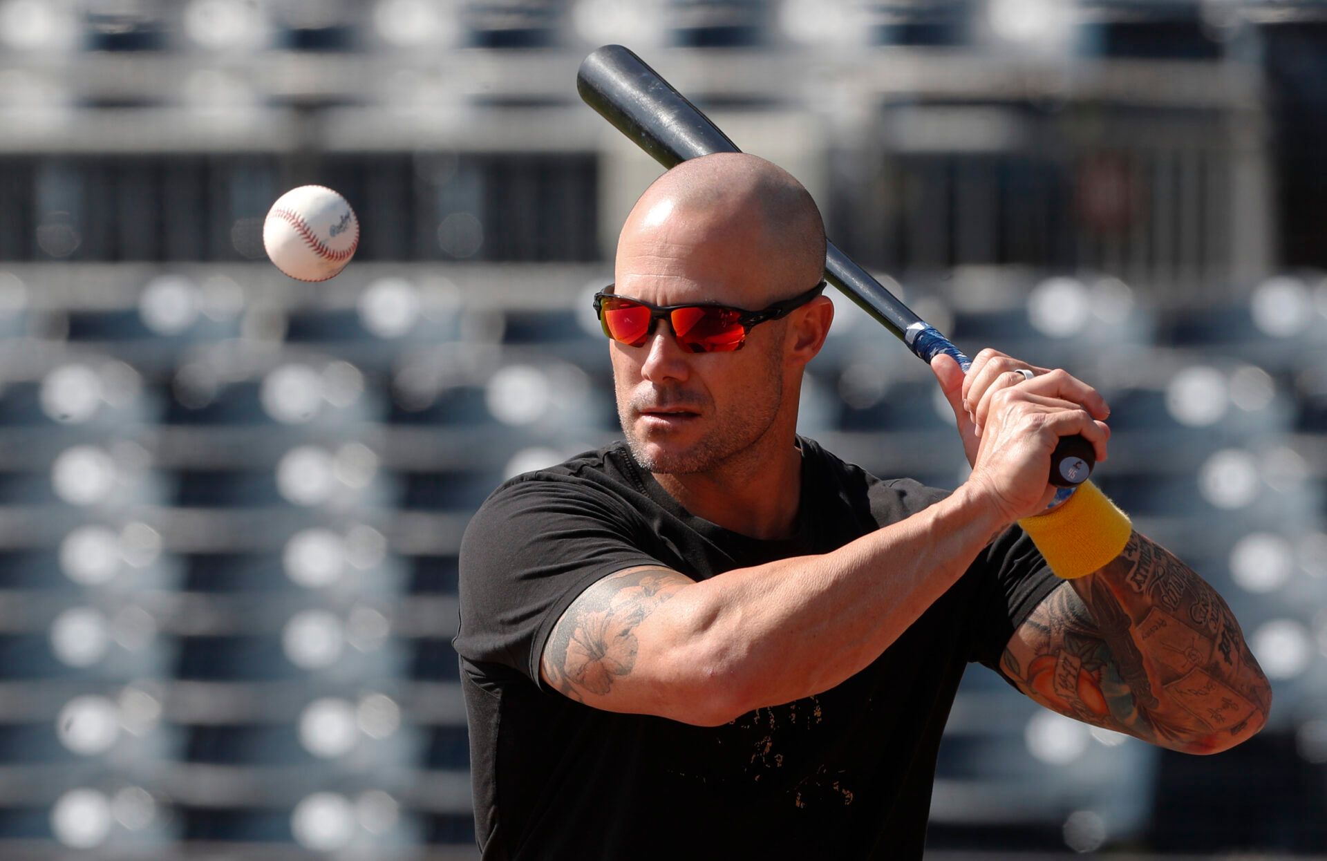 Miami Marlins manager Skip Schumaker (45) hits fungos before a game against the Pittsburgh Pirates at PNC Park.