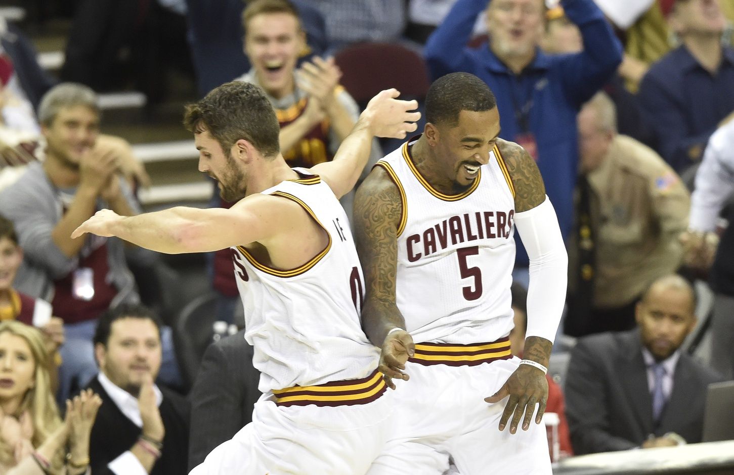 Cleveland Cavaliers forward Kevin Love (0) and guard J.R. Smith (5) celebrate a three point basket in the first quarter against the Portland Trail Blazers at Quicken Loans Arena.