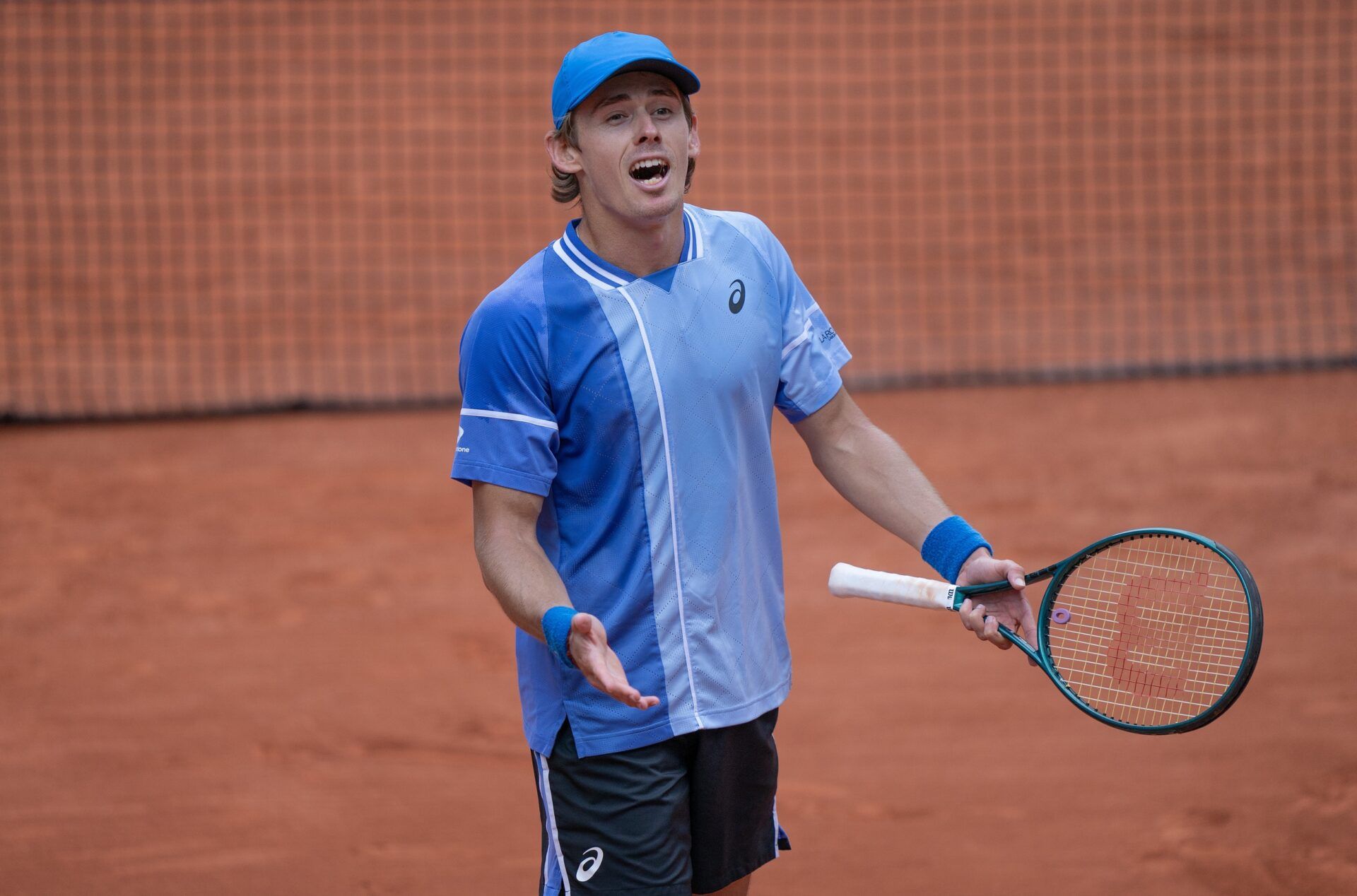 Alex De Minaur of Australia celebrates winning his match against Daniil Medvedev on day nine of Roland Garros at Stade Roland Garros.