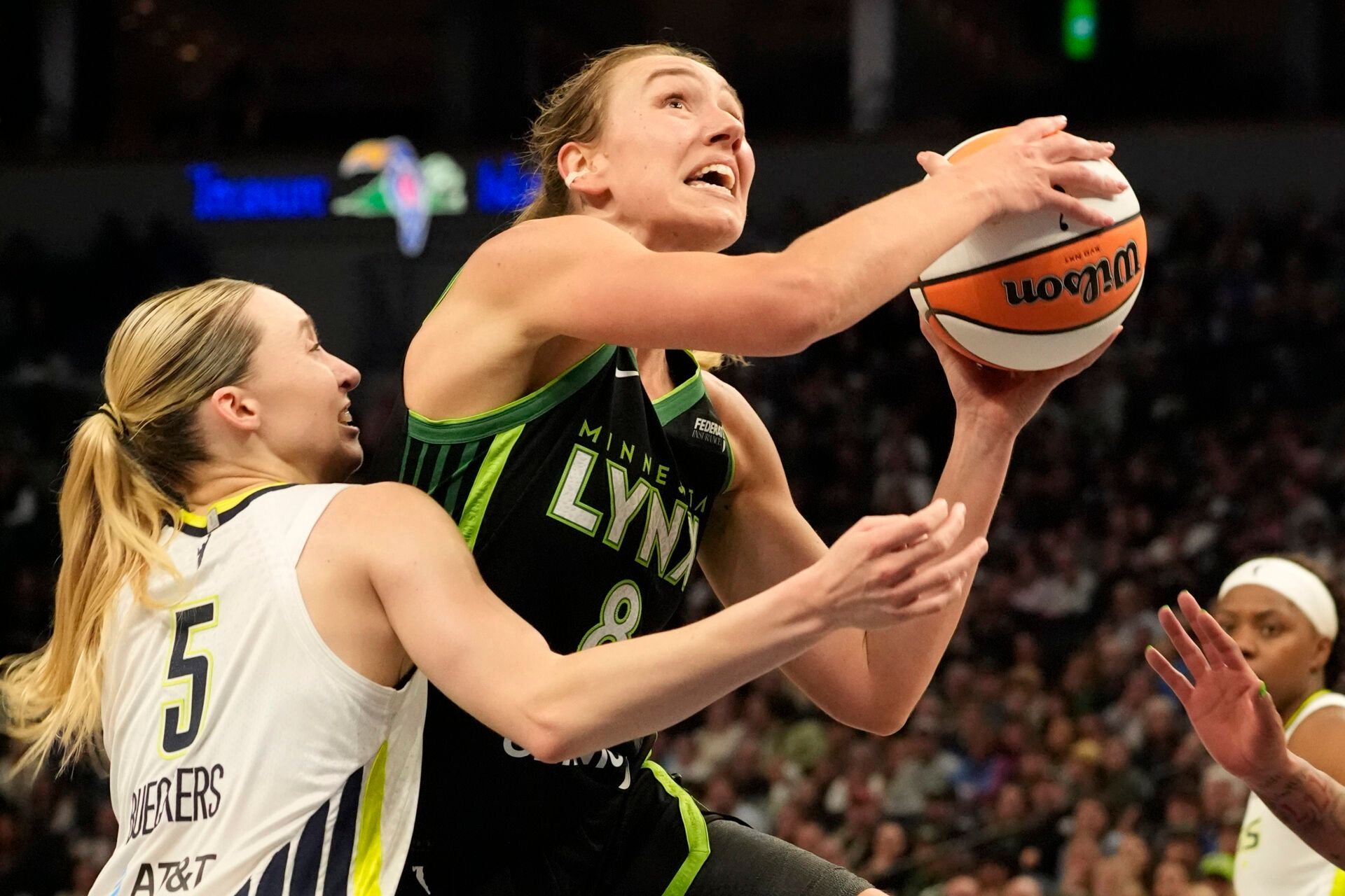 Minnesota Lynx forward Alanna Smith (8) drives to the basket against Dallas Wings guard Paige Bueckers (5) in the fourth quarter at Target Center.