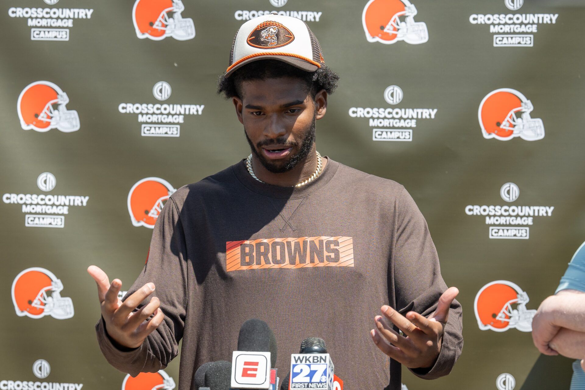 Cleveland Browns quarterback Shedeur Sanders (12) talks to the media during rookie minicamp at CrossCountry Mortgage Campus.