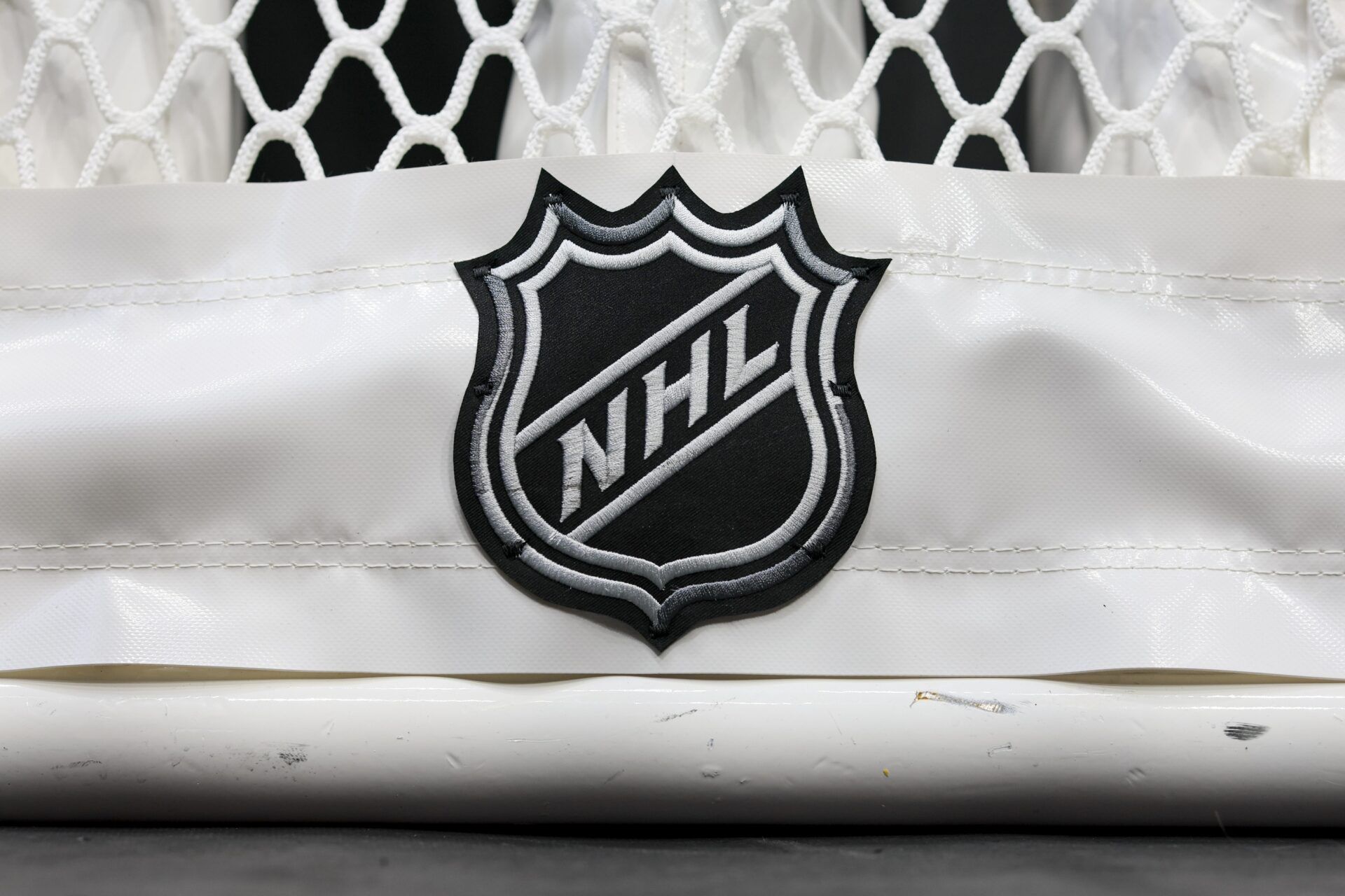 The NHL logo is seen on the netting of a goal prior to the game between the Nashville Predators and the Columbus Blue Jackets at Nationwide Arena.