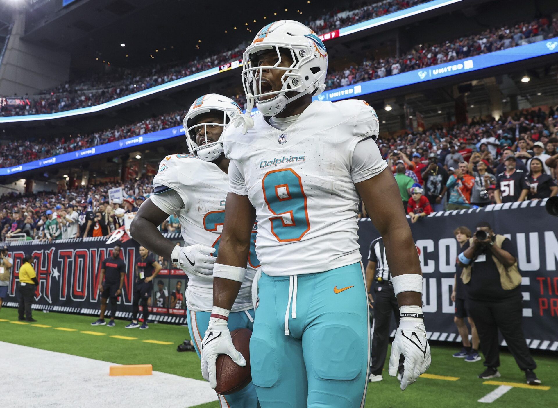 Miami Dolphins tight end Jonnu Smith (9) reacts after a touchdown reception during the game against the Houston Texans at NRG Stadium.