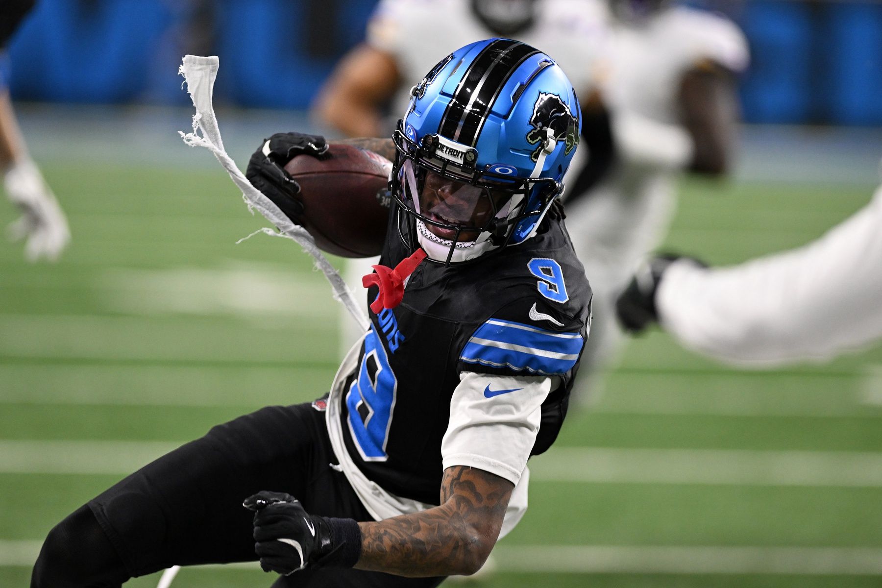 Detroit Lions wide receiver Jameson Williams (9) heads upfield after catching a pass against the  Minnesota Vikings in the fourth quarter at Ford Field.