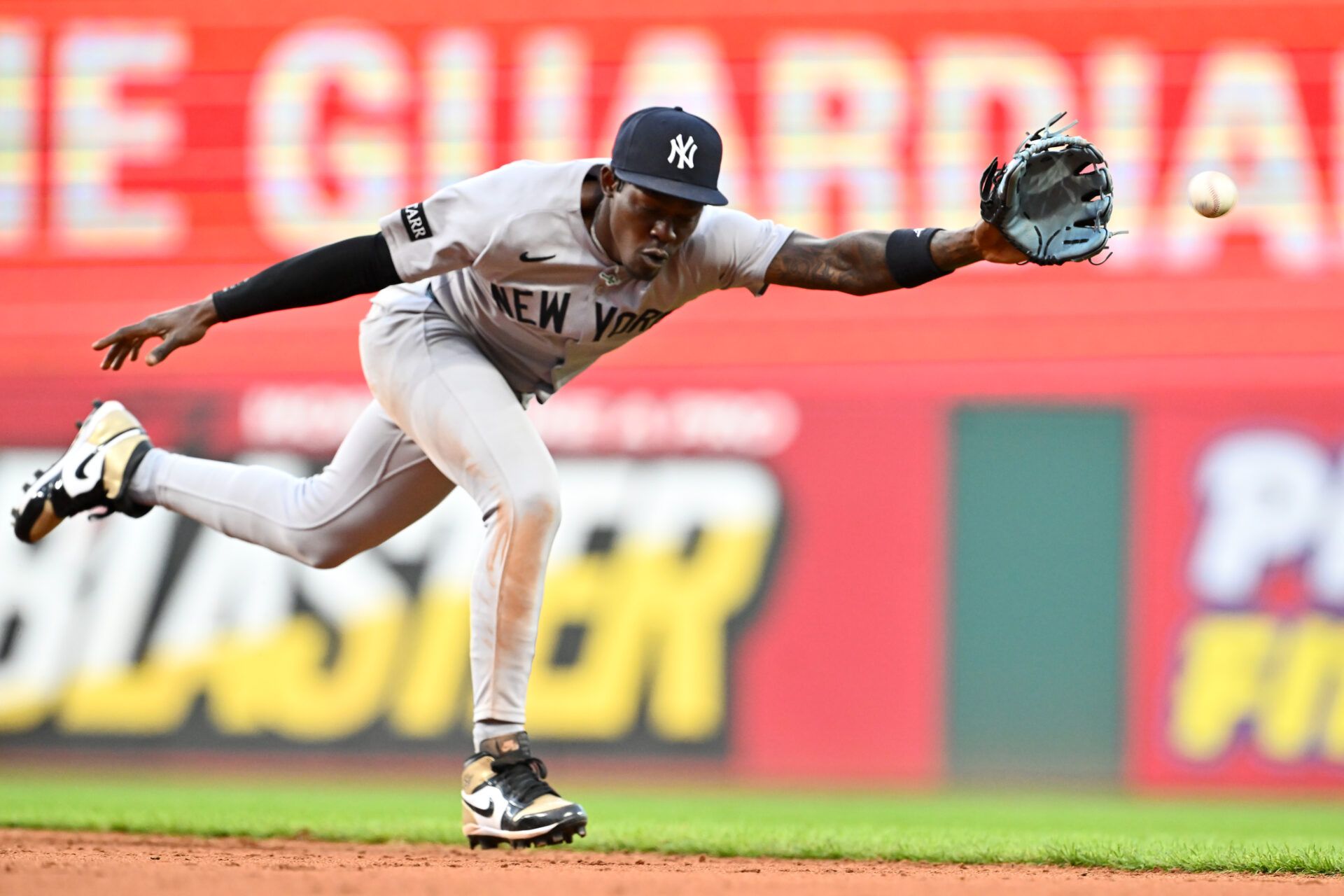 CLEVELAND, OHIO - APRIL 22: Second baseman Jazz Chisholm Jr. #13 of the New York Yankees tries to make a play on a line drive hit by Nolan Jones #22 of the Cleveland Guardians during the sixth inning at Progressive Field on April 22, 2025 in Cleveland, Ohio. (Photo by Jason Miller/Getty Images)